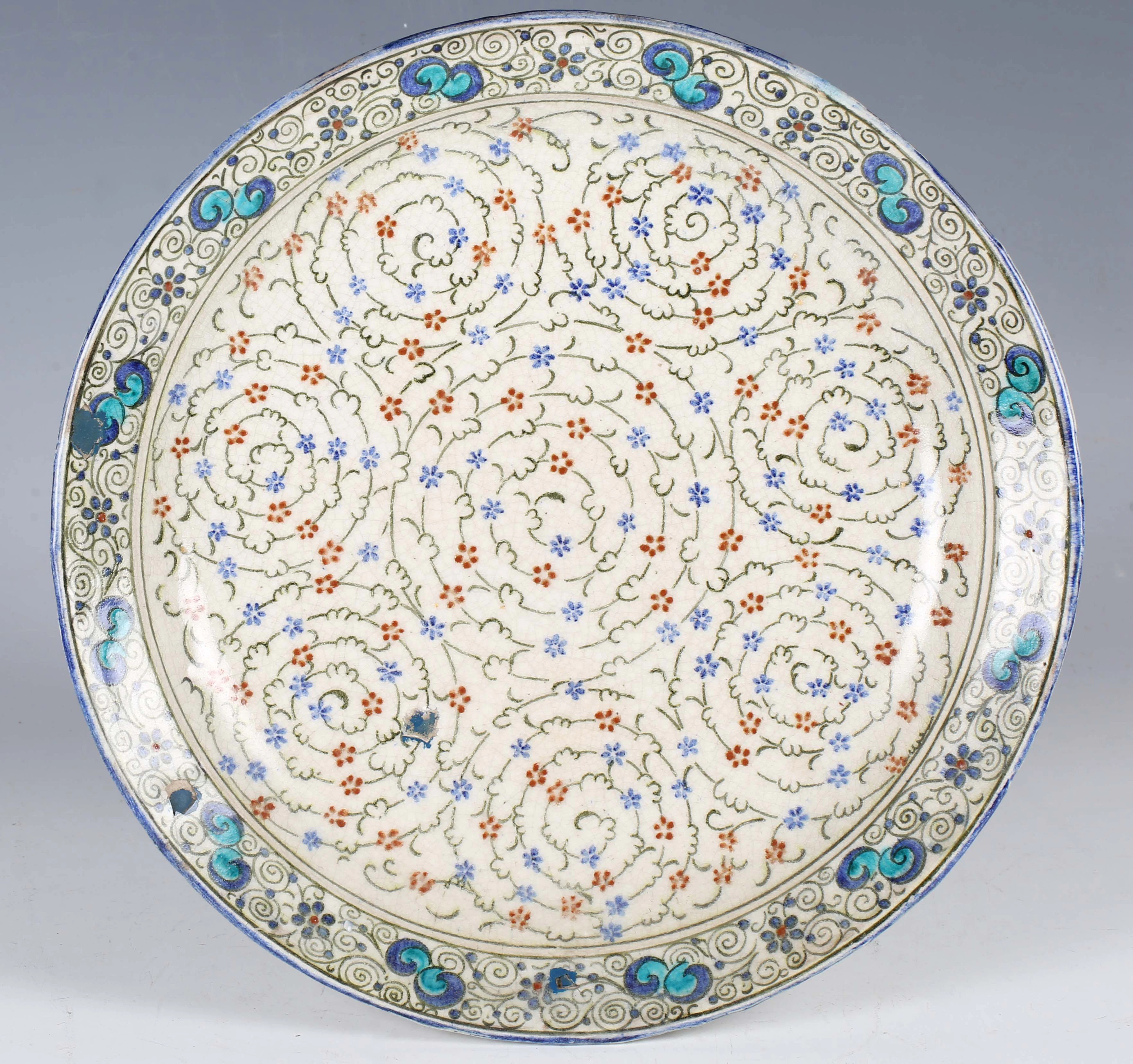 A Doulton Lambeth Persian Ware pottery circular dish, 1920s, painted