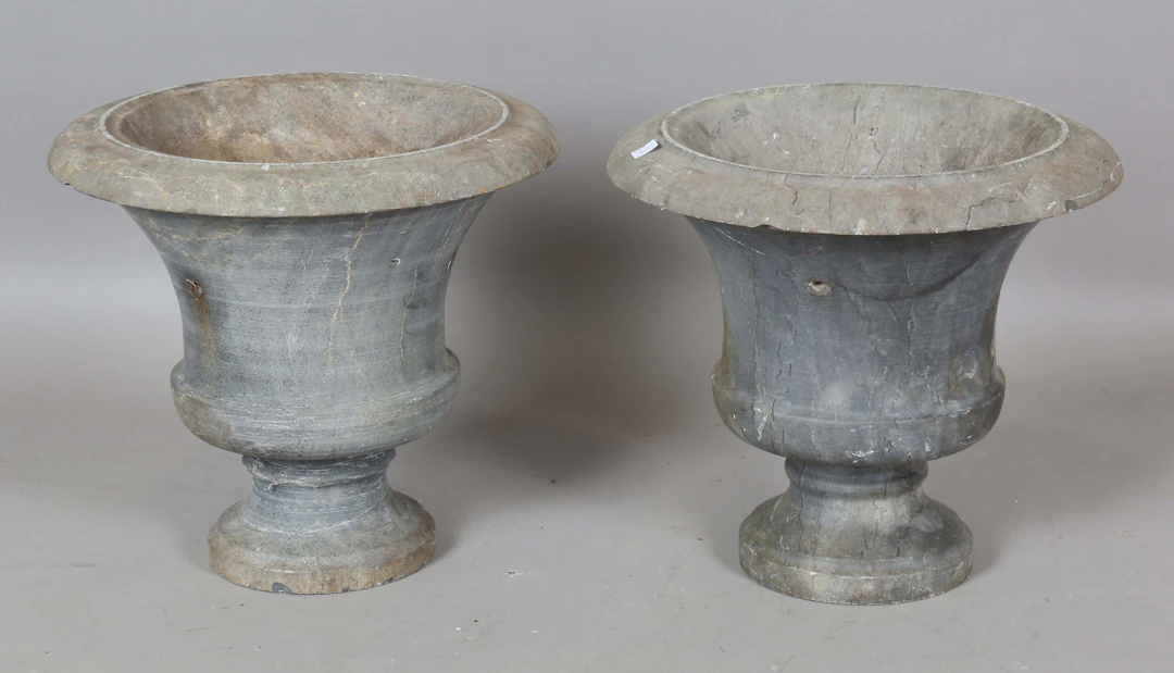 A pair of 19th century turned slate garden urns, height 32cm, diameter