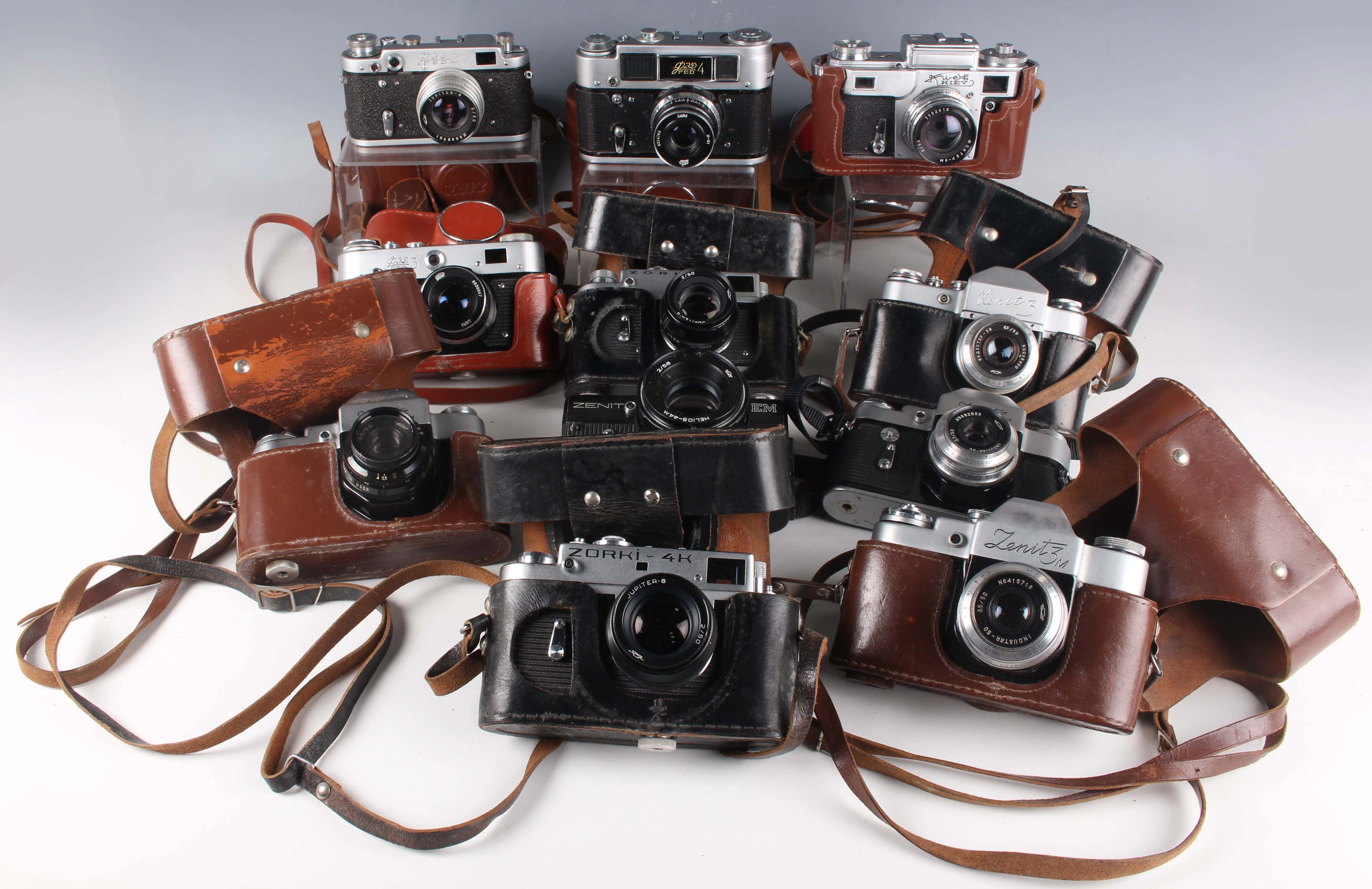 A collection of eleven Russian Soviet-era SLR cameras, comprising