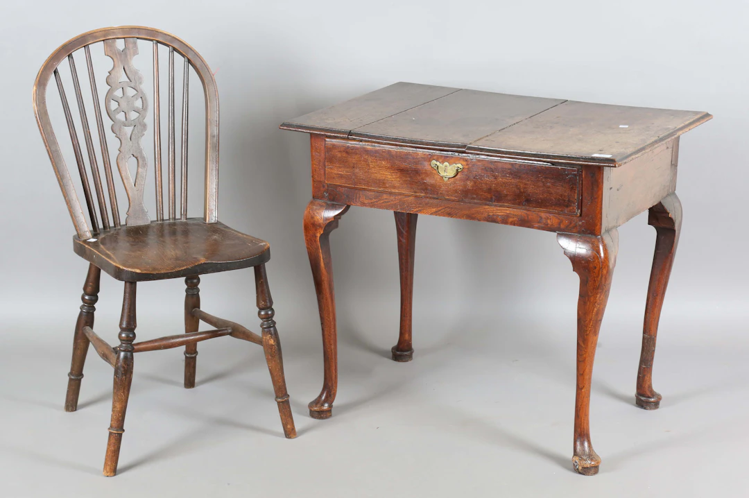 An 18th century oak and elm side table, fitted with a single drawer