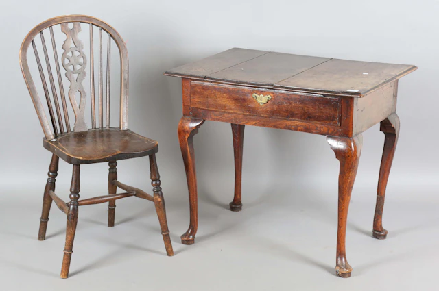 An 18th century oak and elm side table, fitted with a single drawer