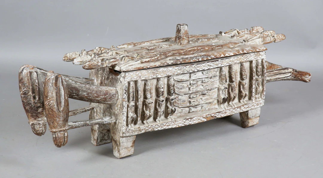 A Dogon Aduno koro, Mali, the carved and limed wooden ritual box modelled