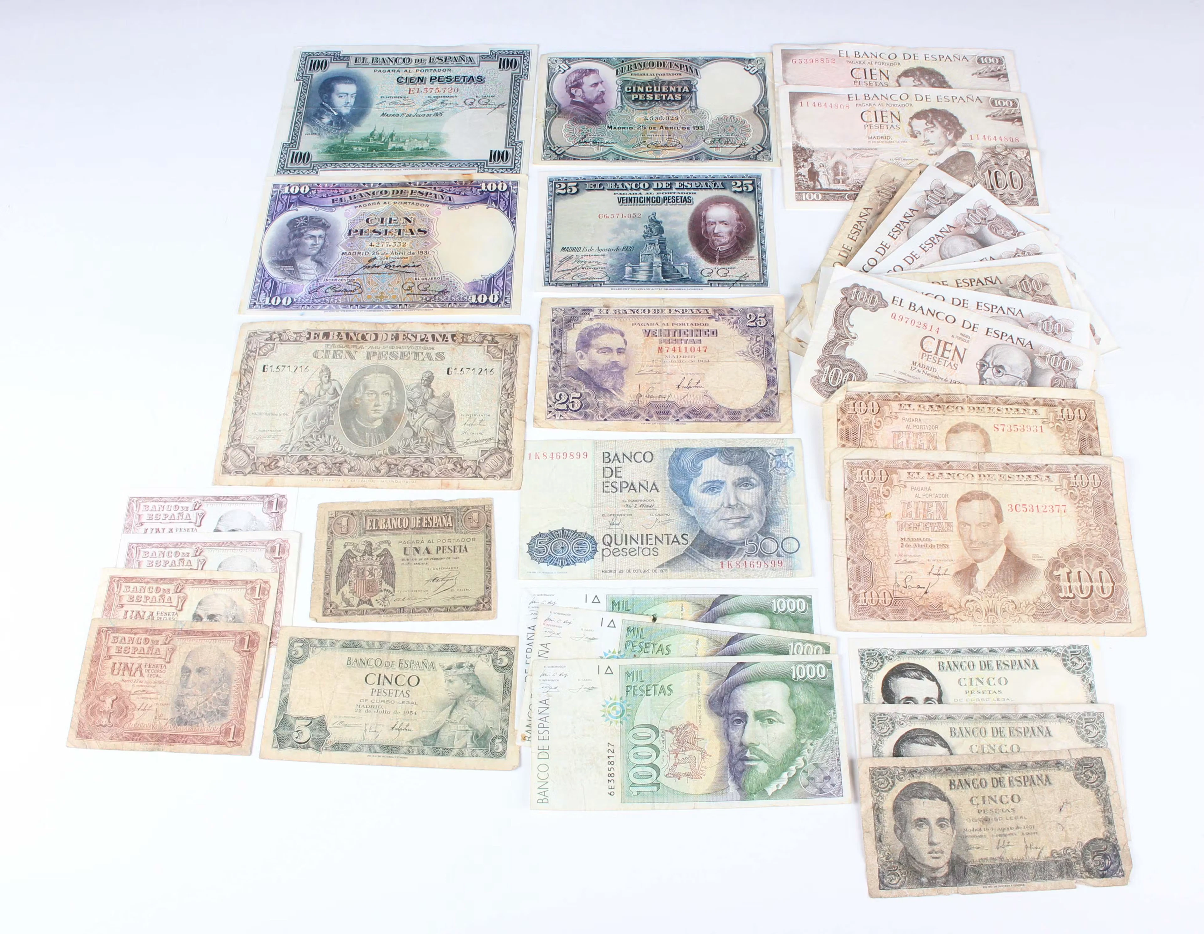 A collection of Spanish and Portuguese banknotes, including a Bank