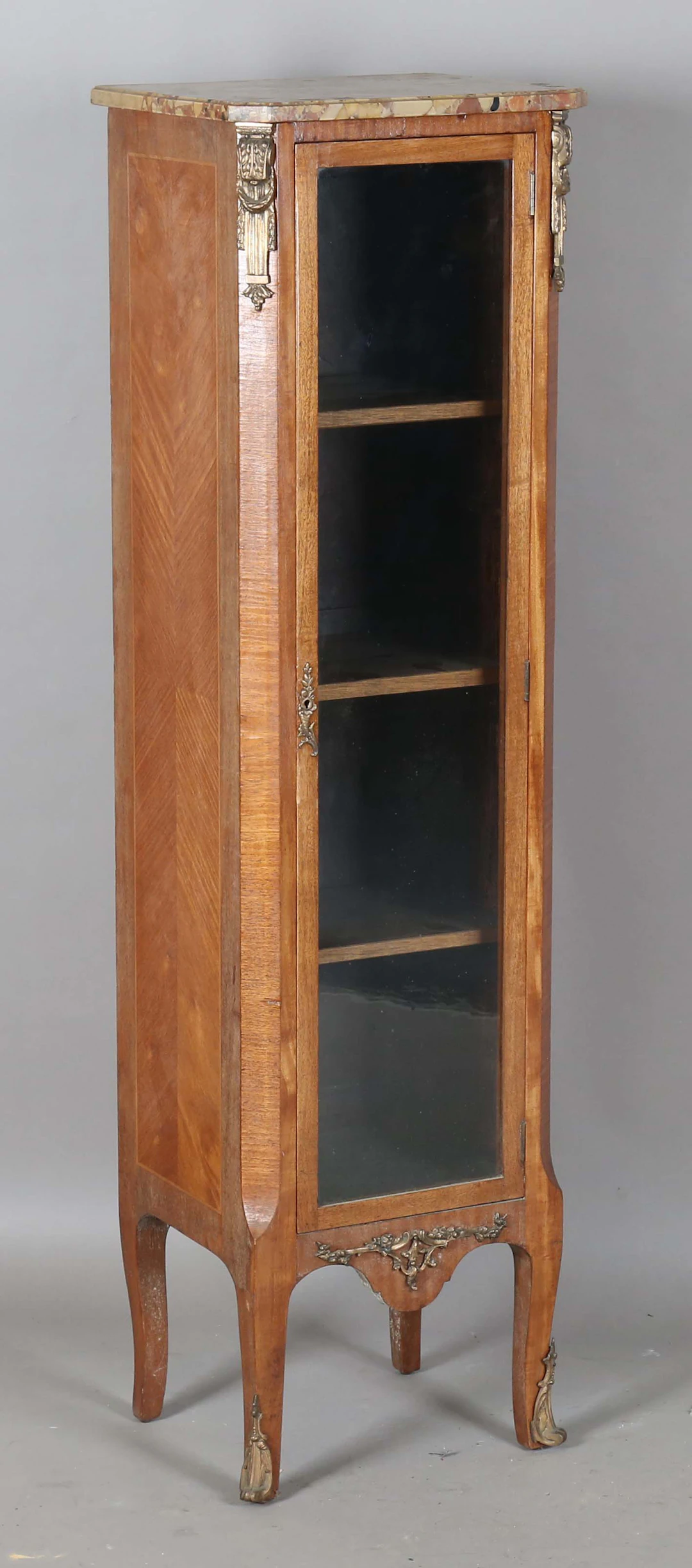 An early 20th century French kingwood narrow display cabinet, the