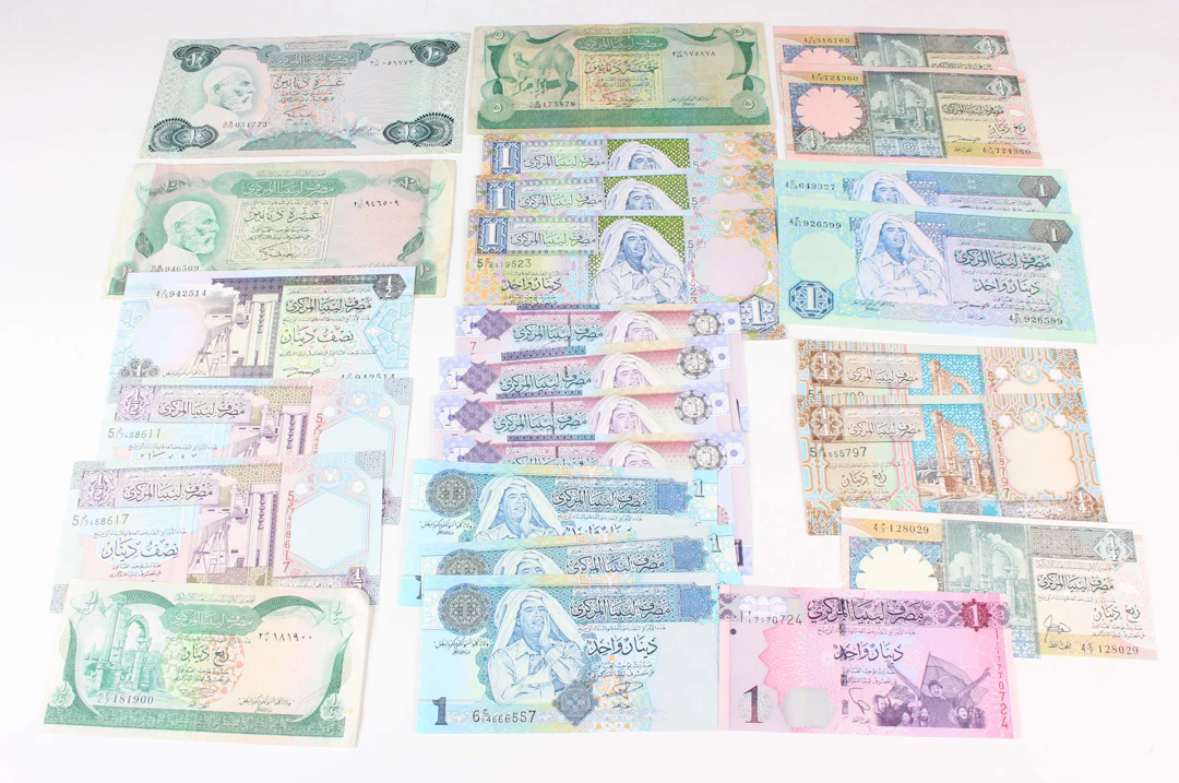 A large collection of Middle Eastern banknotes, including Saudi Arabia
