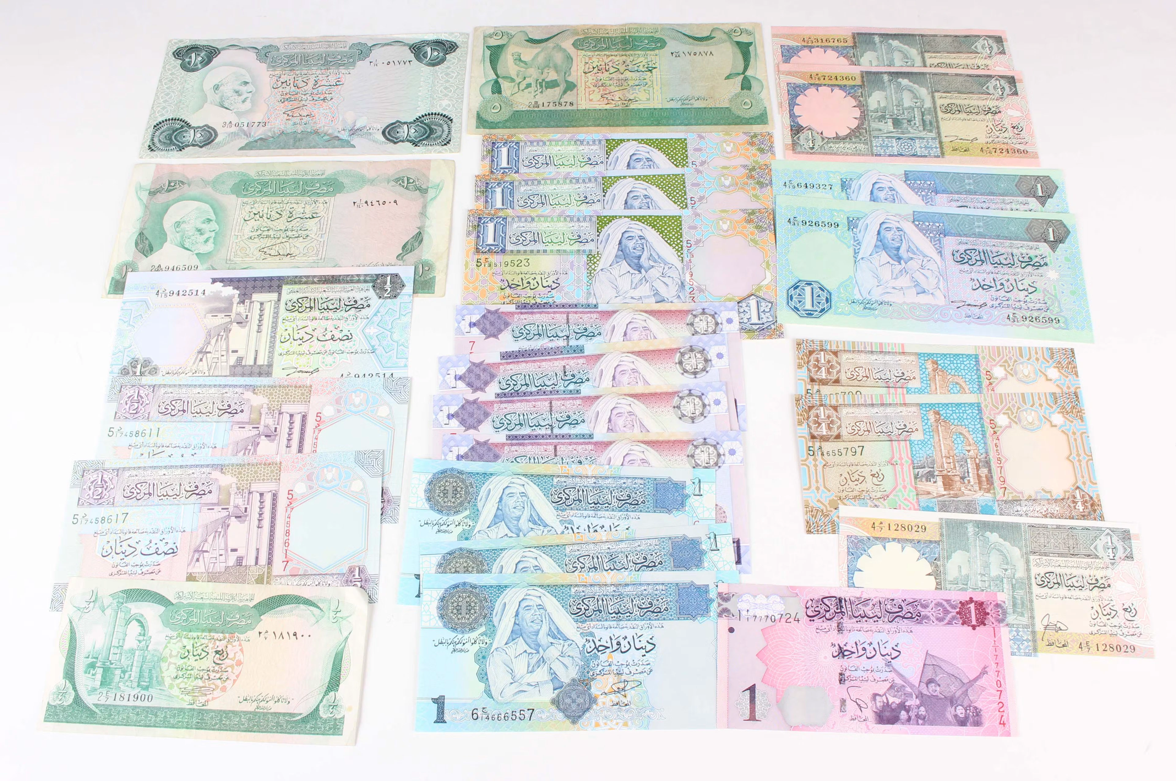 A large collection of Middle Eastern banknotes, including Saudi Arabia
