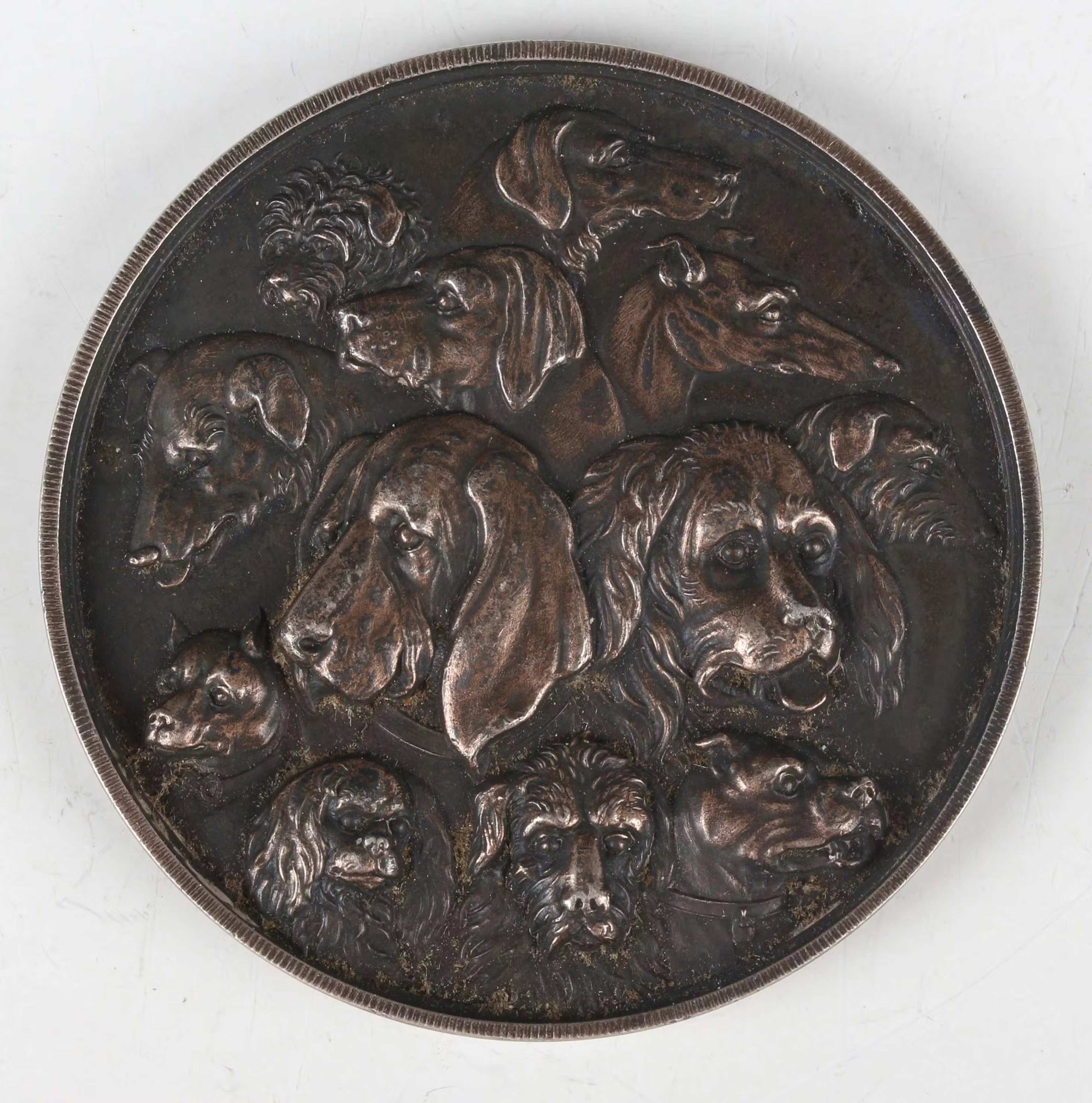 An unusual 19th century white metal medallion, obverse detailed with