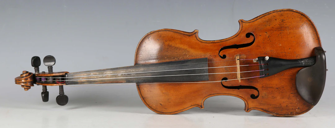A violin with two-piece back, length of back excluding button 35.3cm