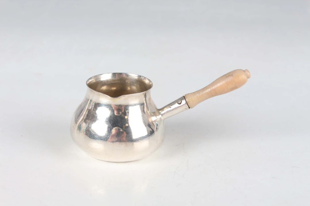 A George II miniature toy silver brandy pan of circular bombé form