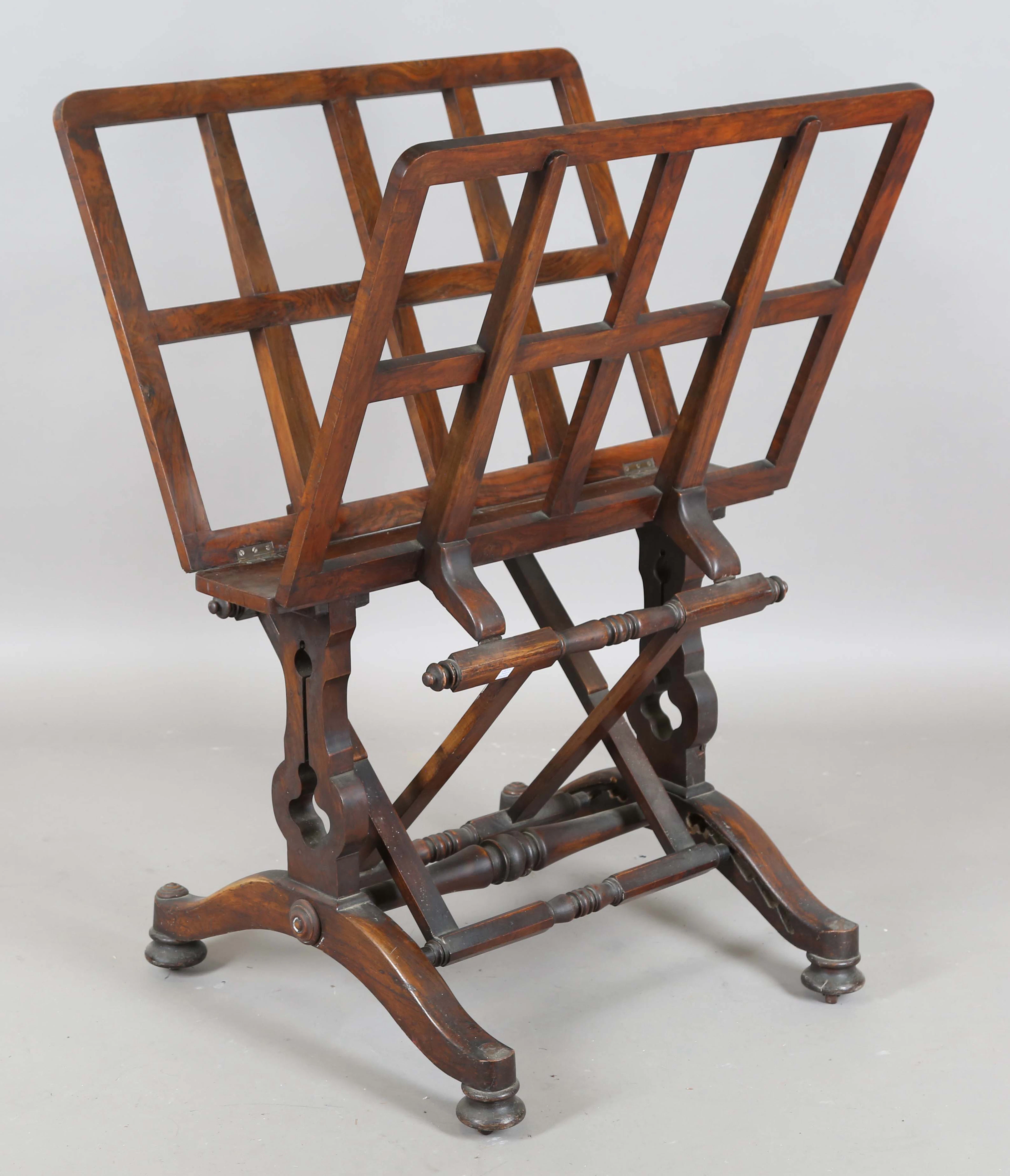 An early Victorian walnut framed folio stand with ratchet mechanism