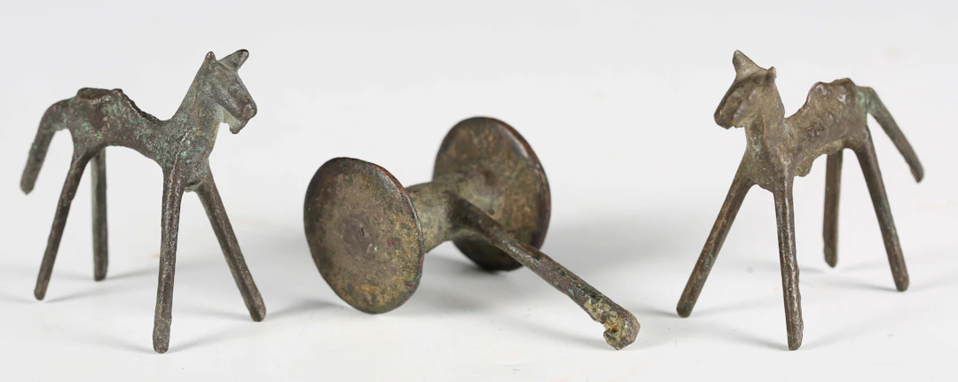A pair of Luristan bronze models of stylized horses, circa 1200-600