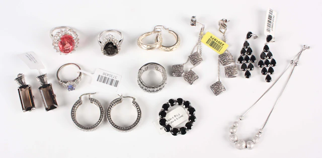 A collection of silver and gem set jewellery, comprising four rings