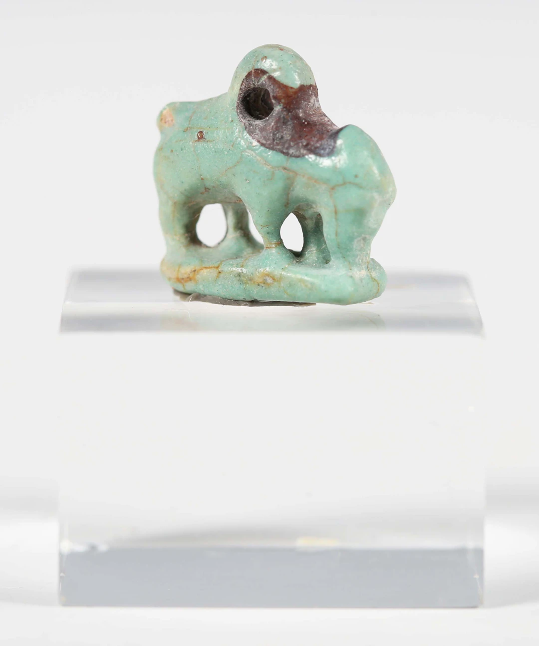 An ancient Egyptian light blue glazed faience amulet, representing