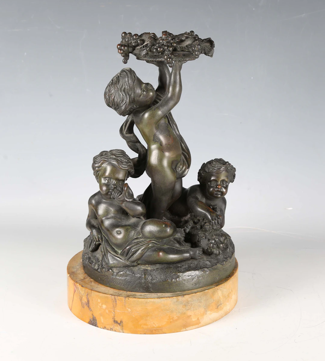 A 19th century French green patinated cast bronze figure group of