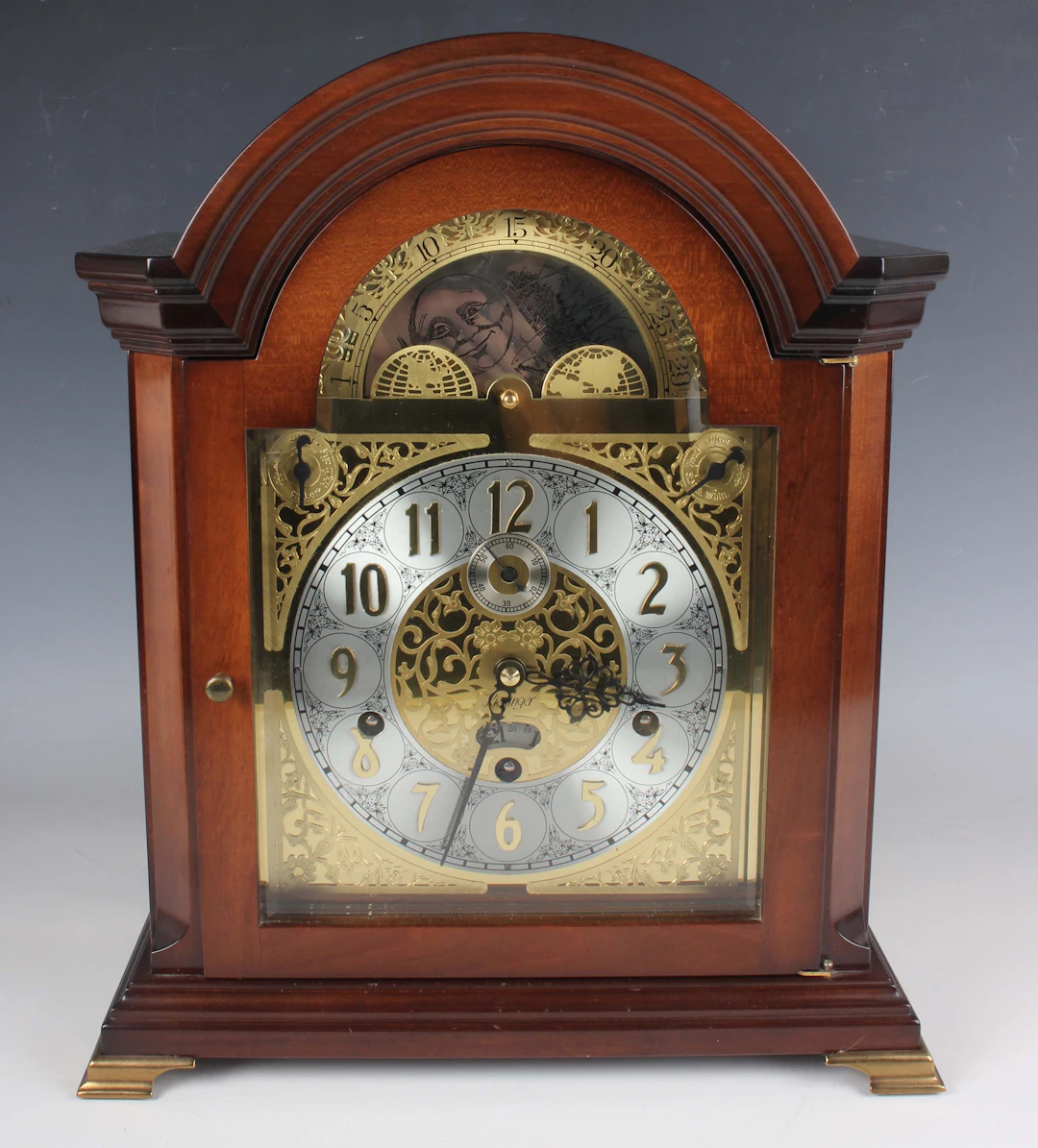 A late 20th century mahogany and bevelled glass mantel clock by Kieninger