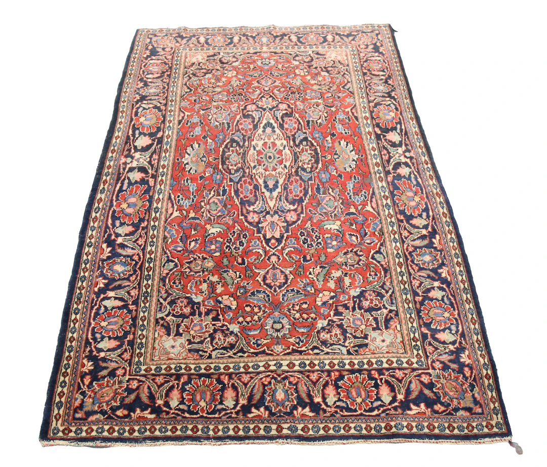 A Kashan rug, Central Persia, mid-20th century, the red field with