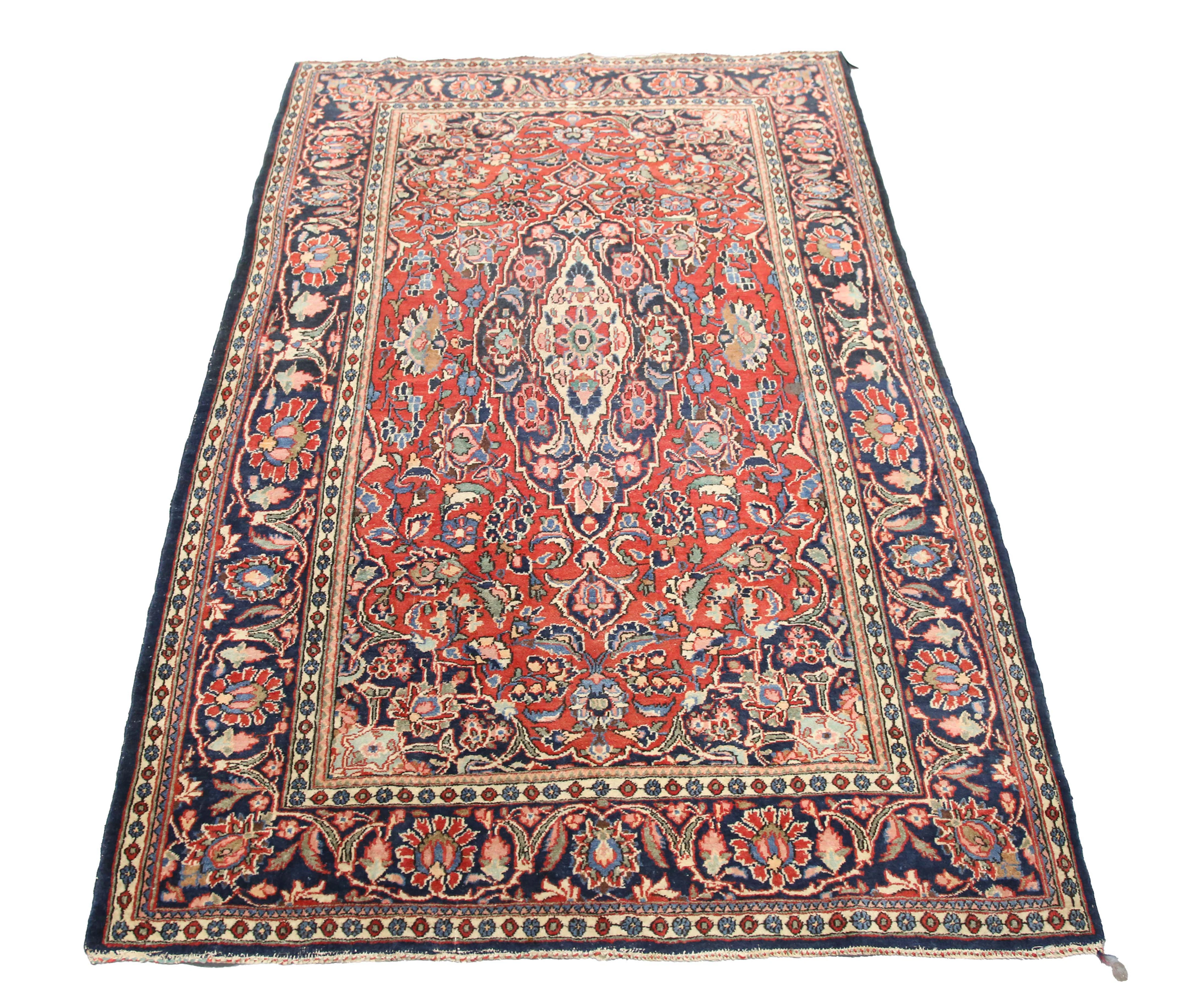 A Kashan rug, Central Persia, mid-20th century, the red field with