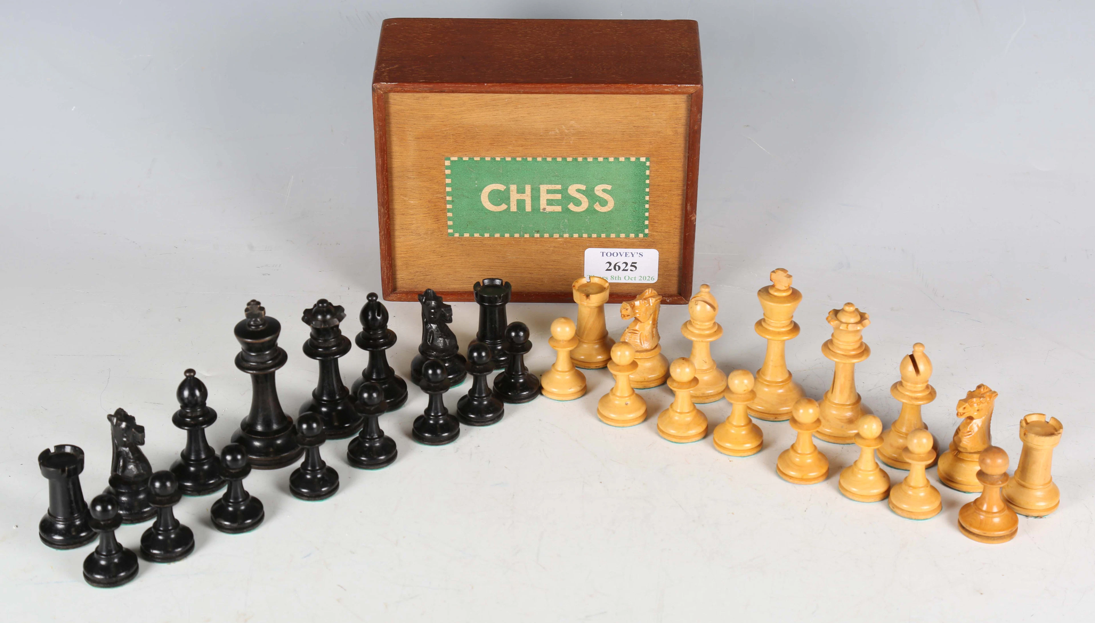 A mid-20th century ebonized and boxwood Staunton chess set, height