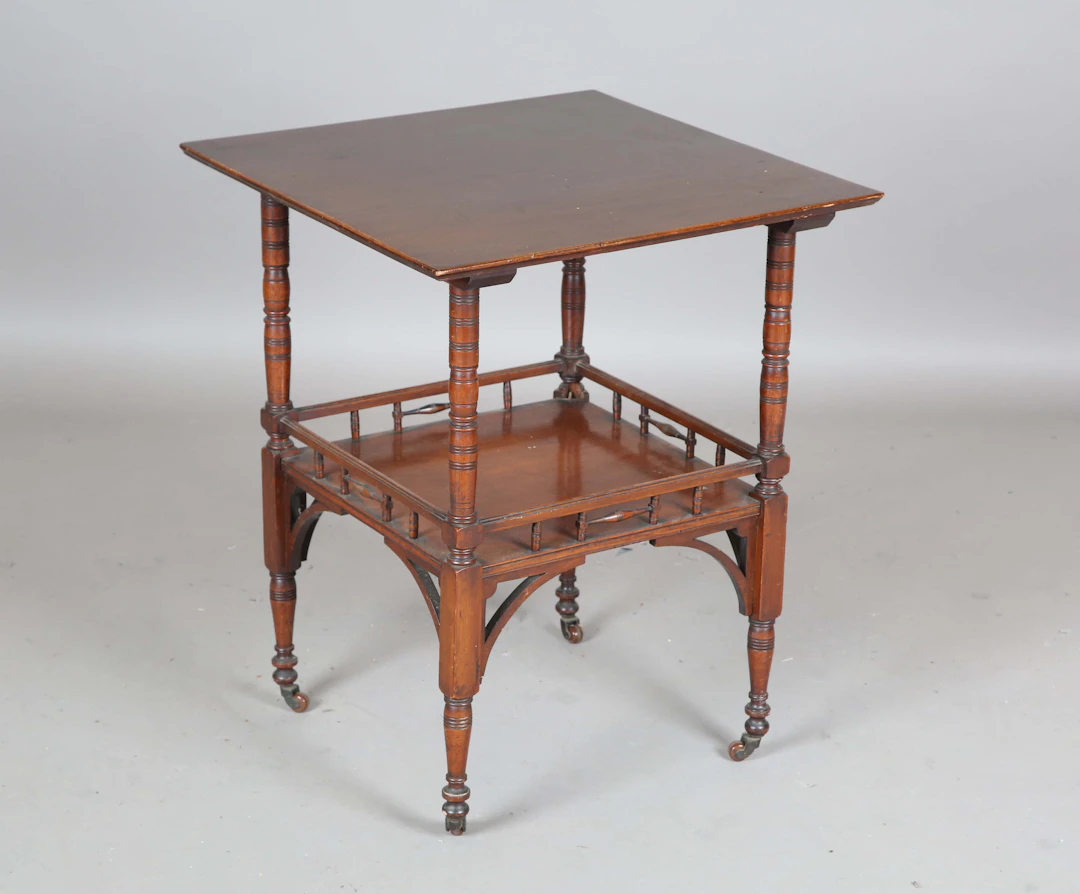A late Victorian Aesthetic Movement walnut square two-tier occasional