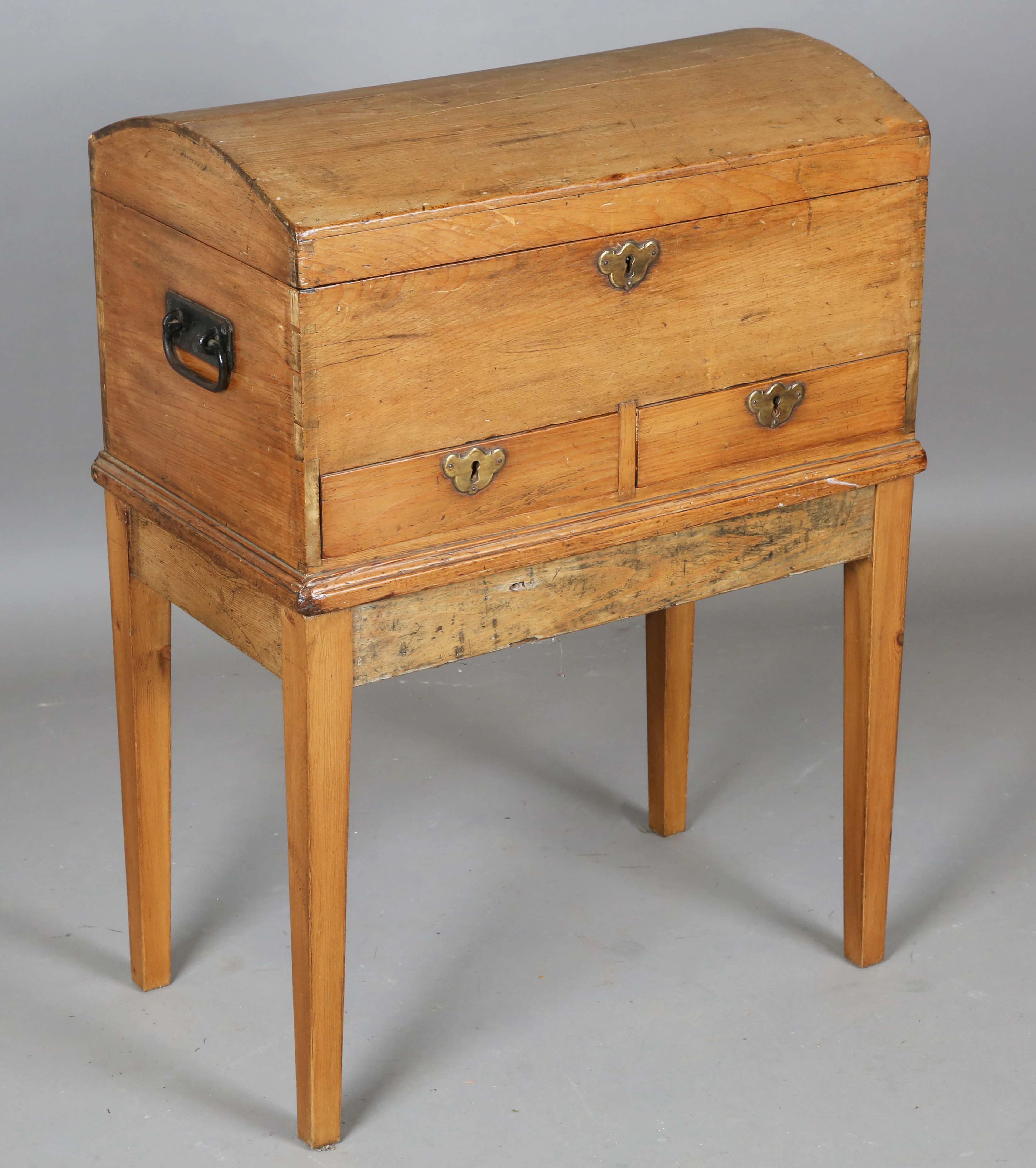 A small George III pine dome-topped trunk, fitted with two drawers