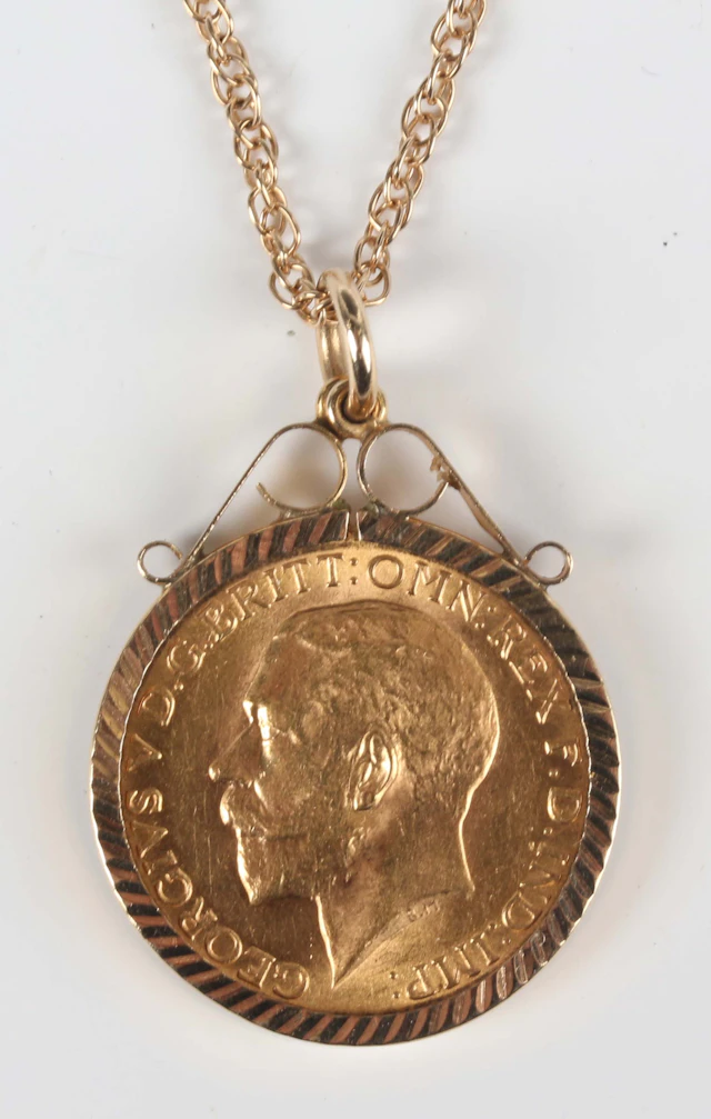 A George V sovereign 1925, South Africa Mint, in a 9ct gold pendant