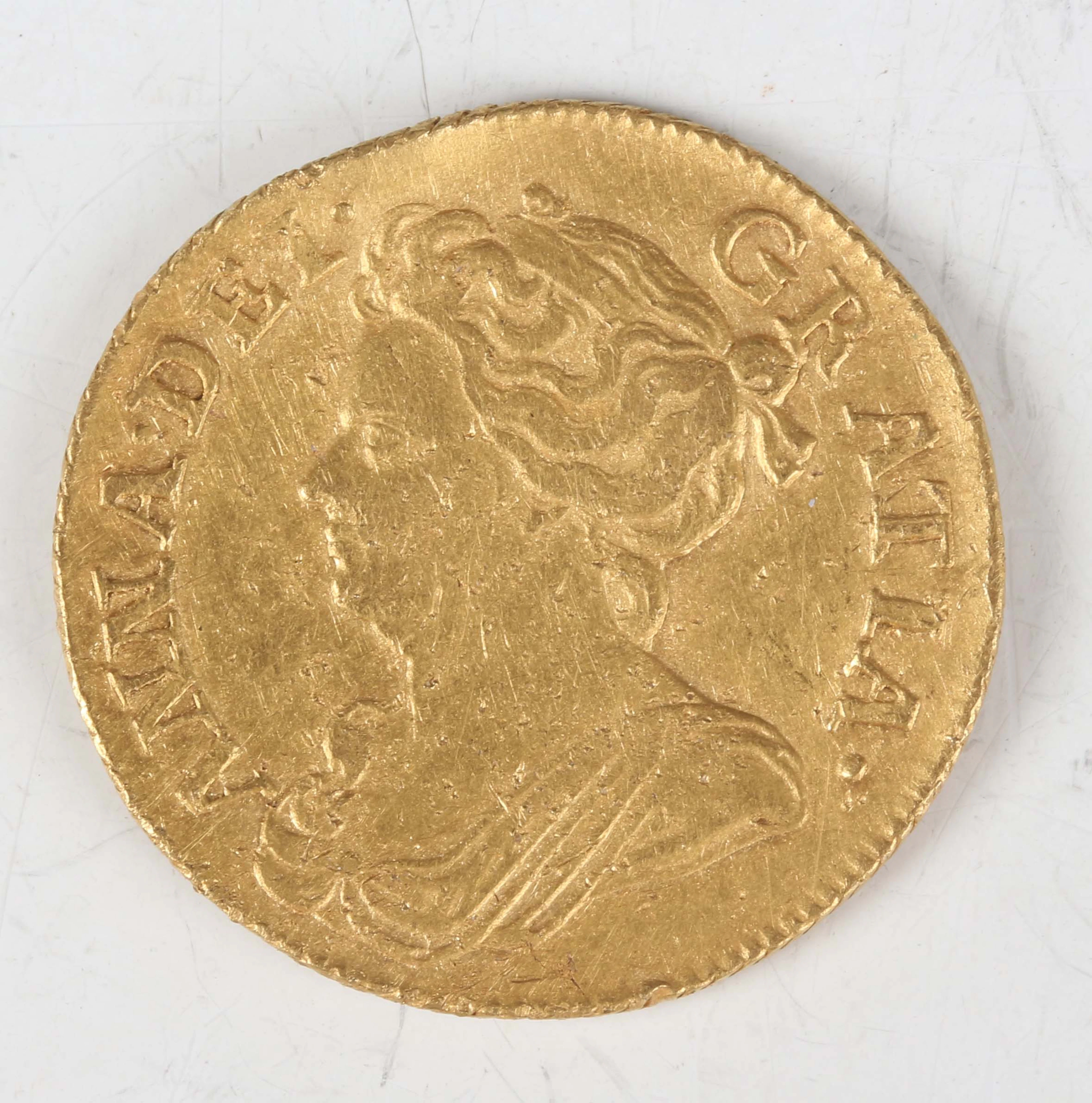 An Anne guinea 1714, third draped bust, Sp 3574 (overall poor, excavated