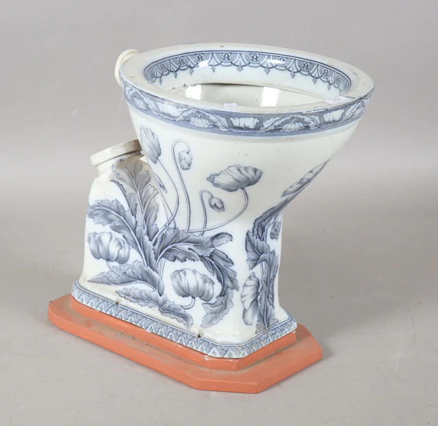 An Art Nouveau blue and white printed porcelain water closet, detailed