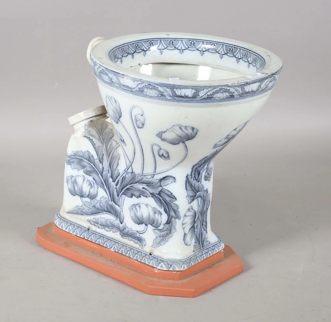 An Art Nouveau blue and white printed porcelain water closet, detailed