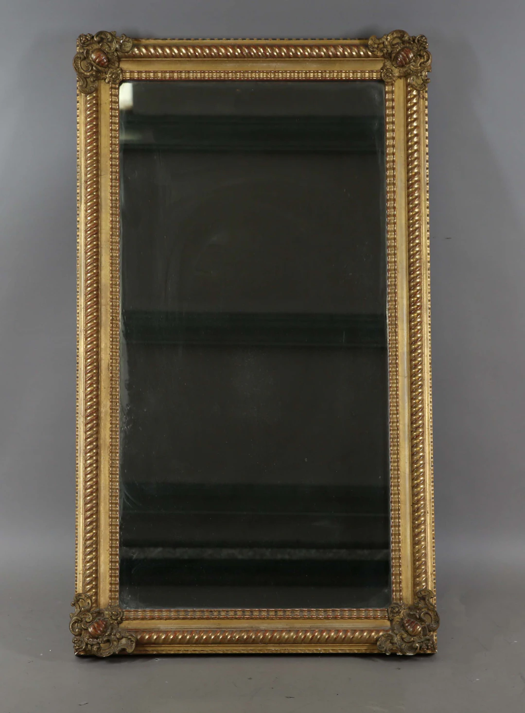A 19th century gilt composition rectangular wall mirror with a spiral