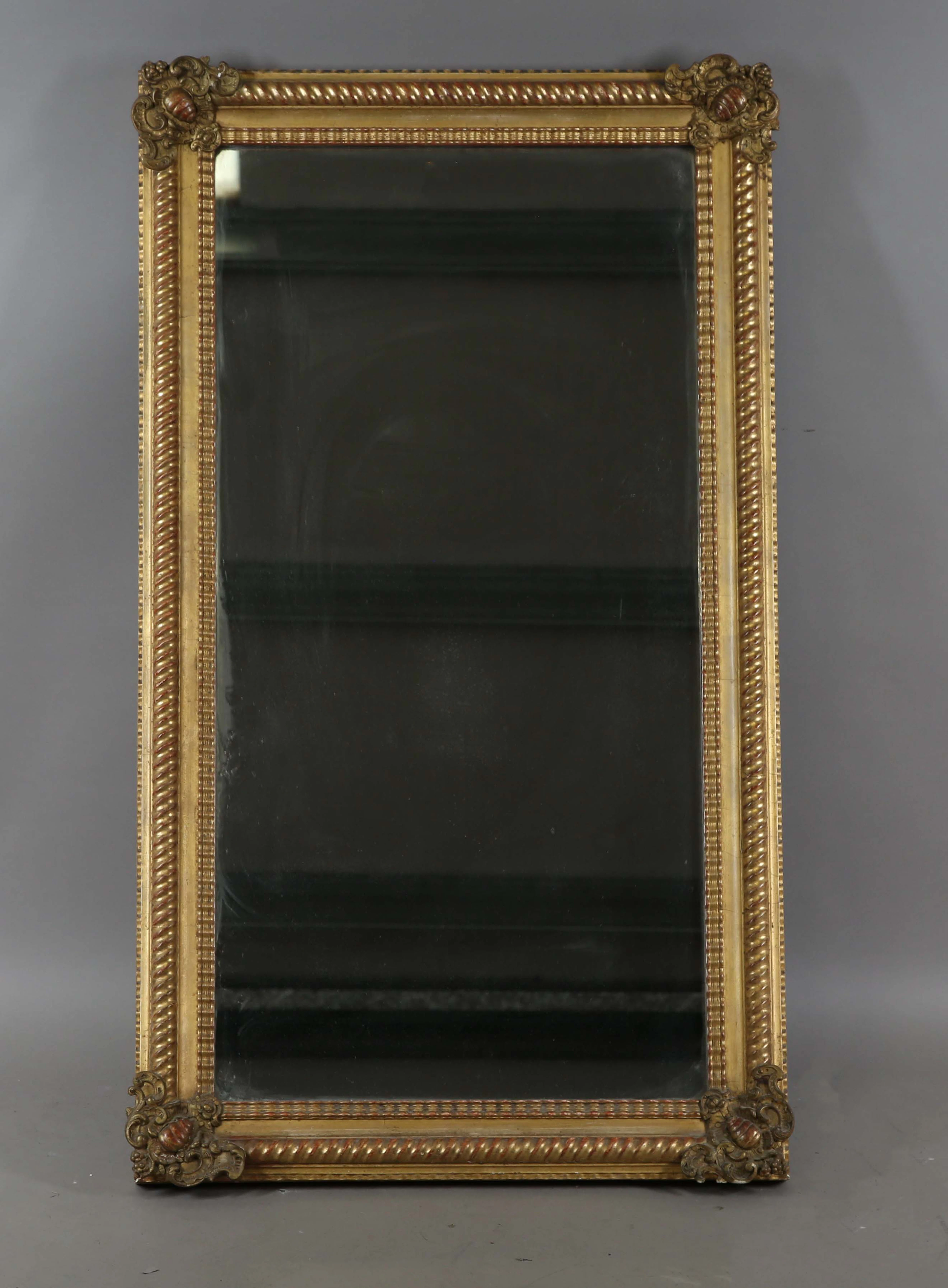 A 19th century gilt composition rectangular wall mirror with a spiral