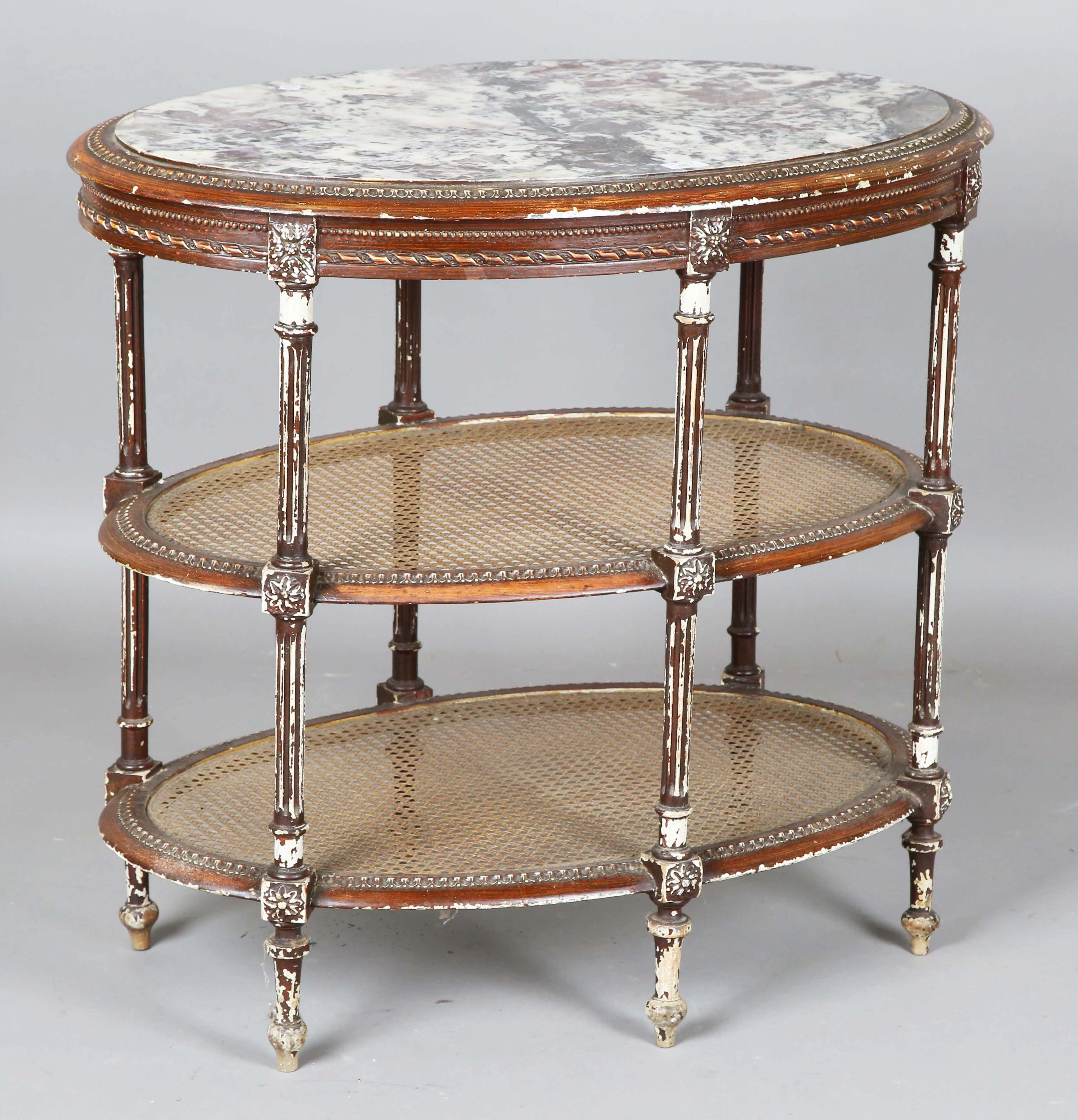 An early 20th century French painted oval three-tier étagère, the