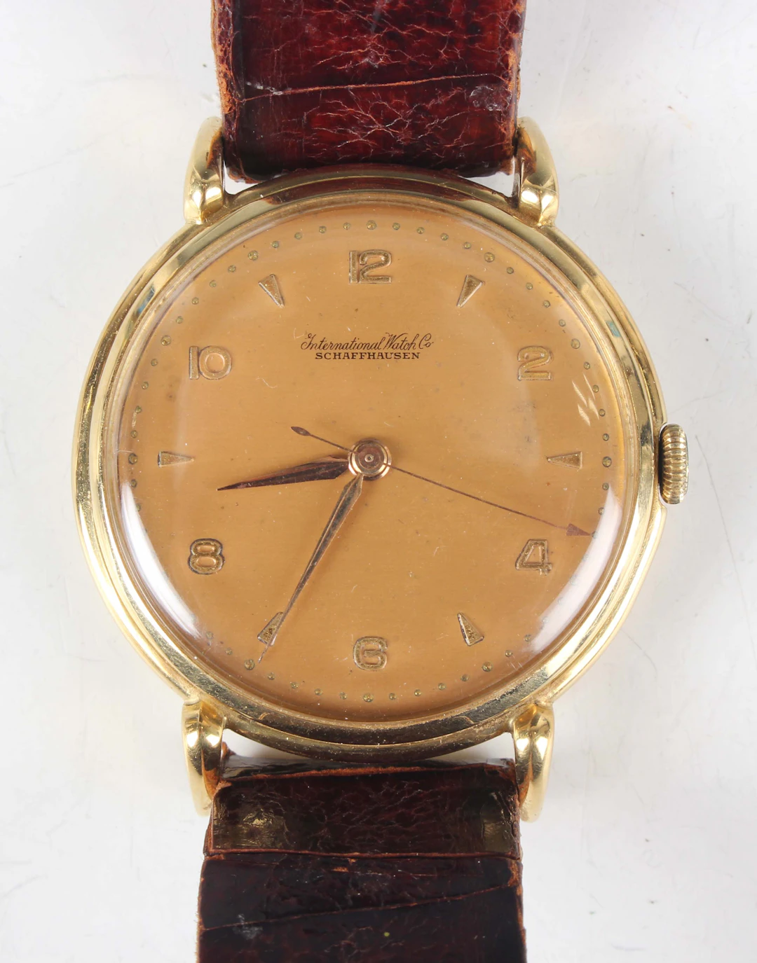 An International Watch Co 18K gold circular cased gentleman's wristwatch