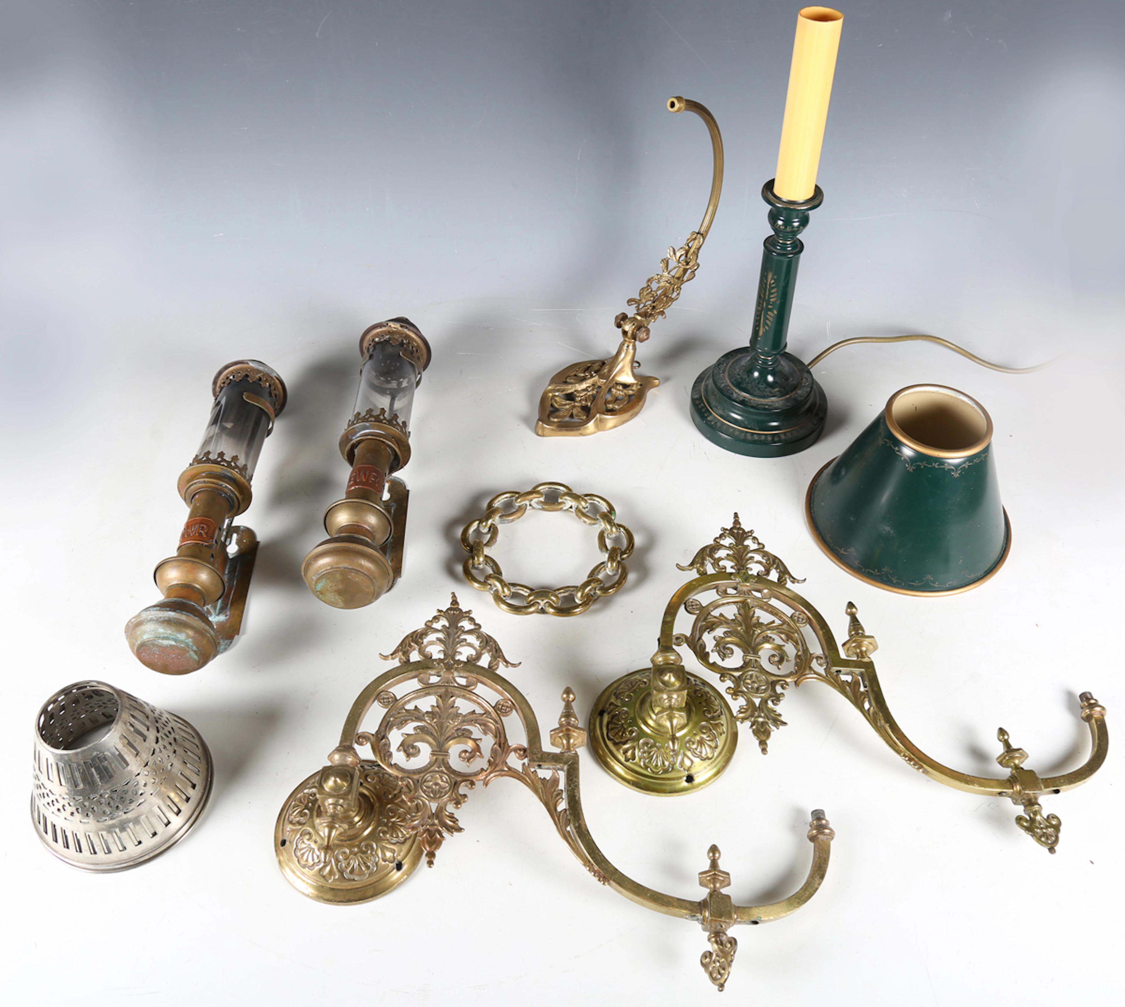 A pair of Victorian brass single branch gas wall sconces of foliate