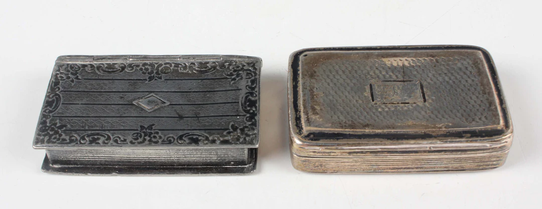 A George IV silver rectangular snuff box with engine turned decoration