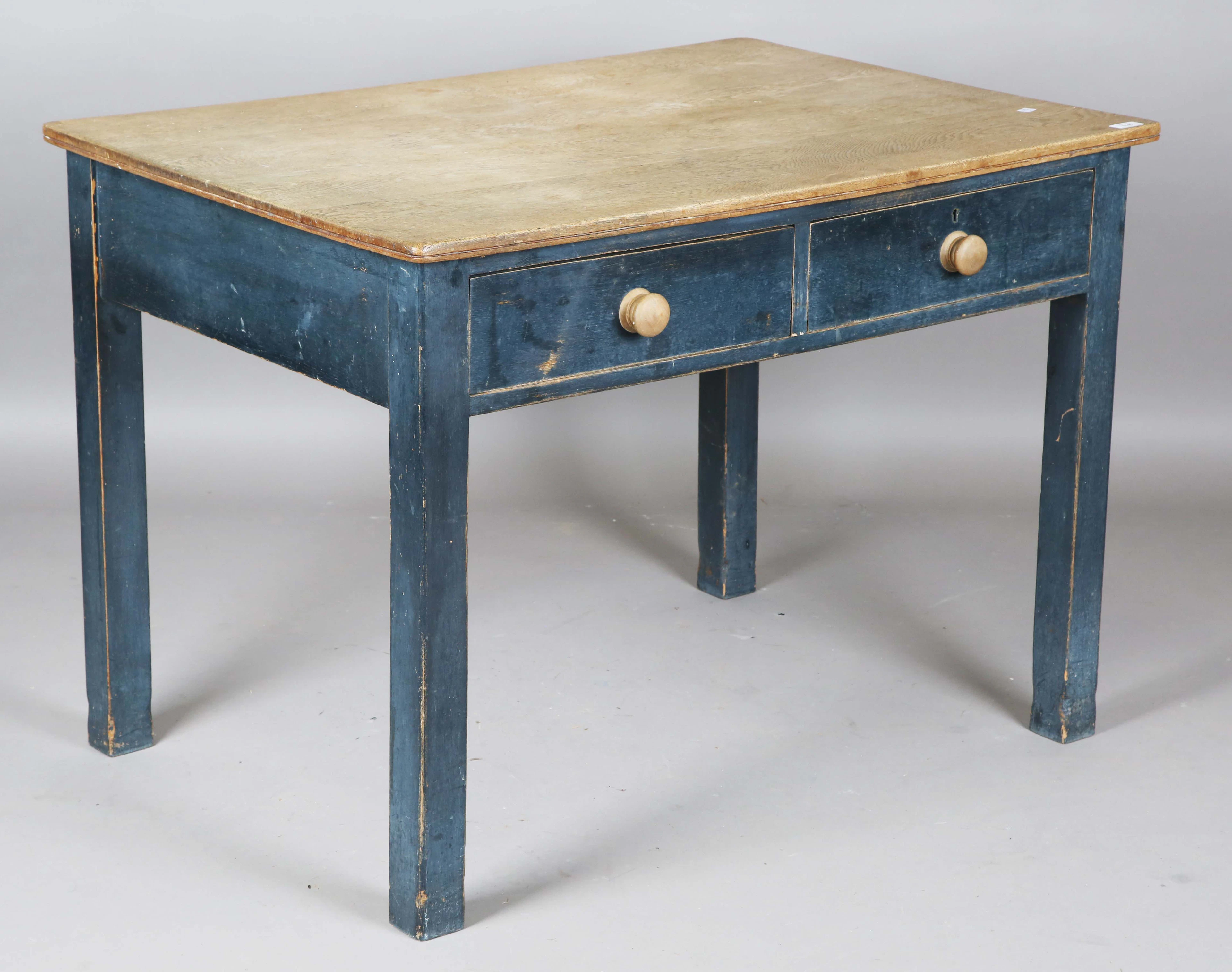 An early 20th century oak and blue painted side table, fitted with