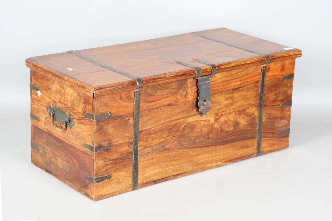 A 20th century hardwood and metal bound trunk, height 44cm, width