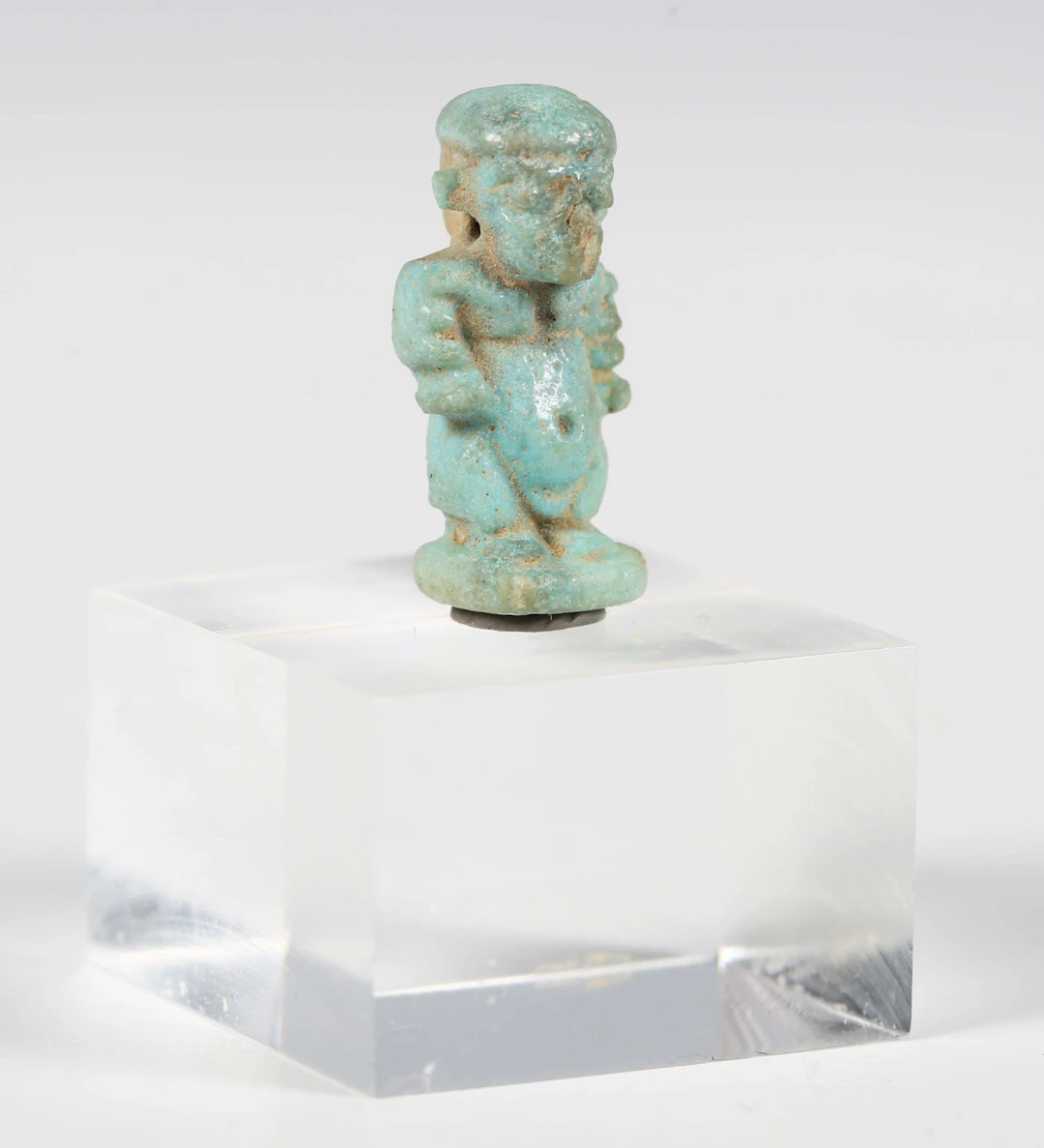 An ancient Egyptian pale blue glazed faience amulet, representing