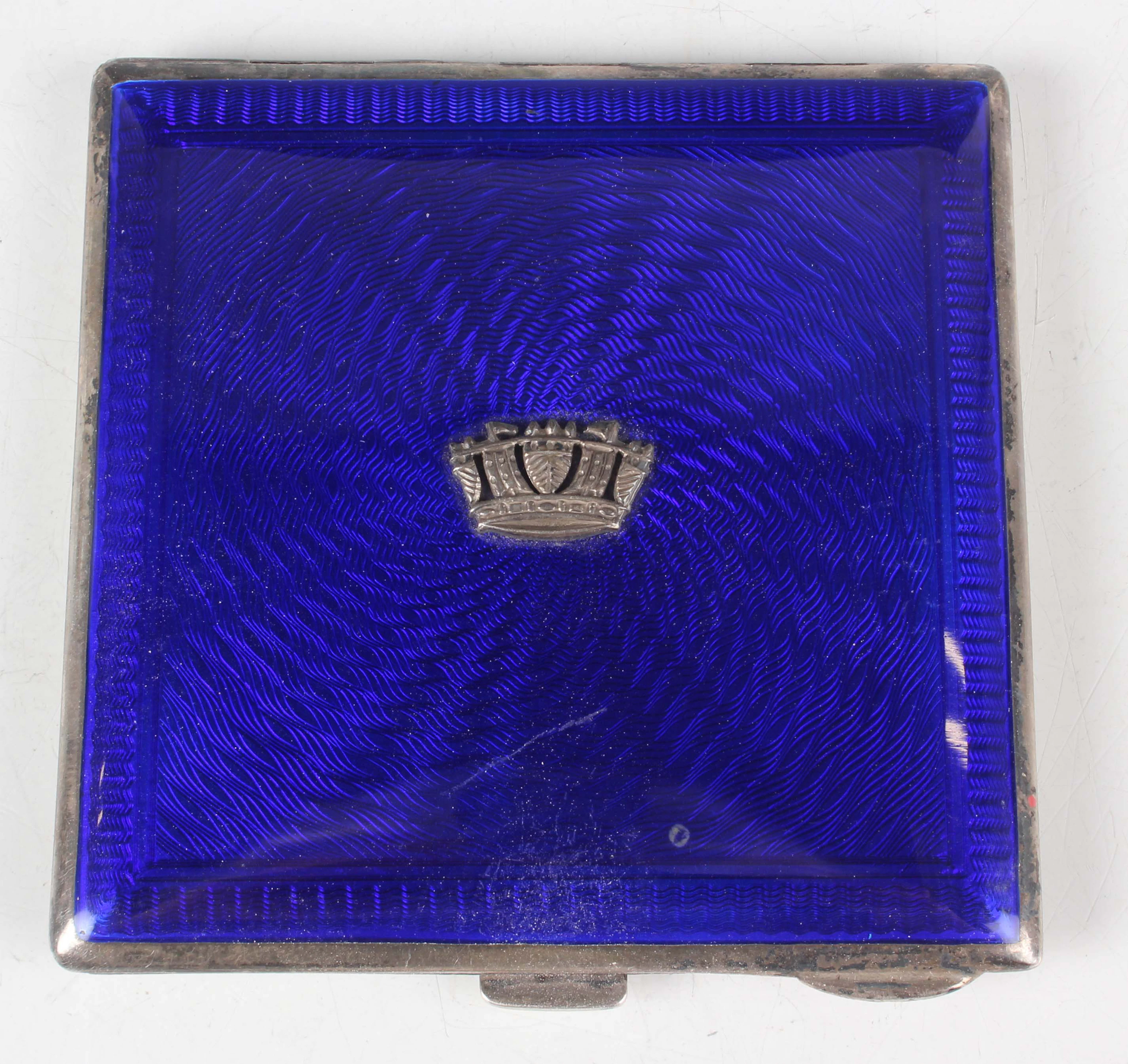 A George V silver and blue enamelled square compact, the enamelled