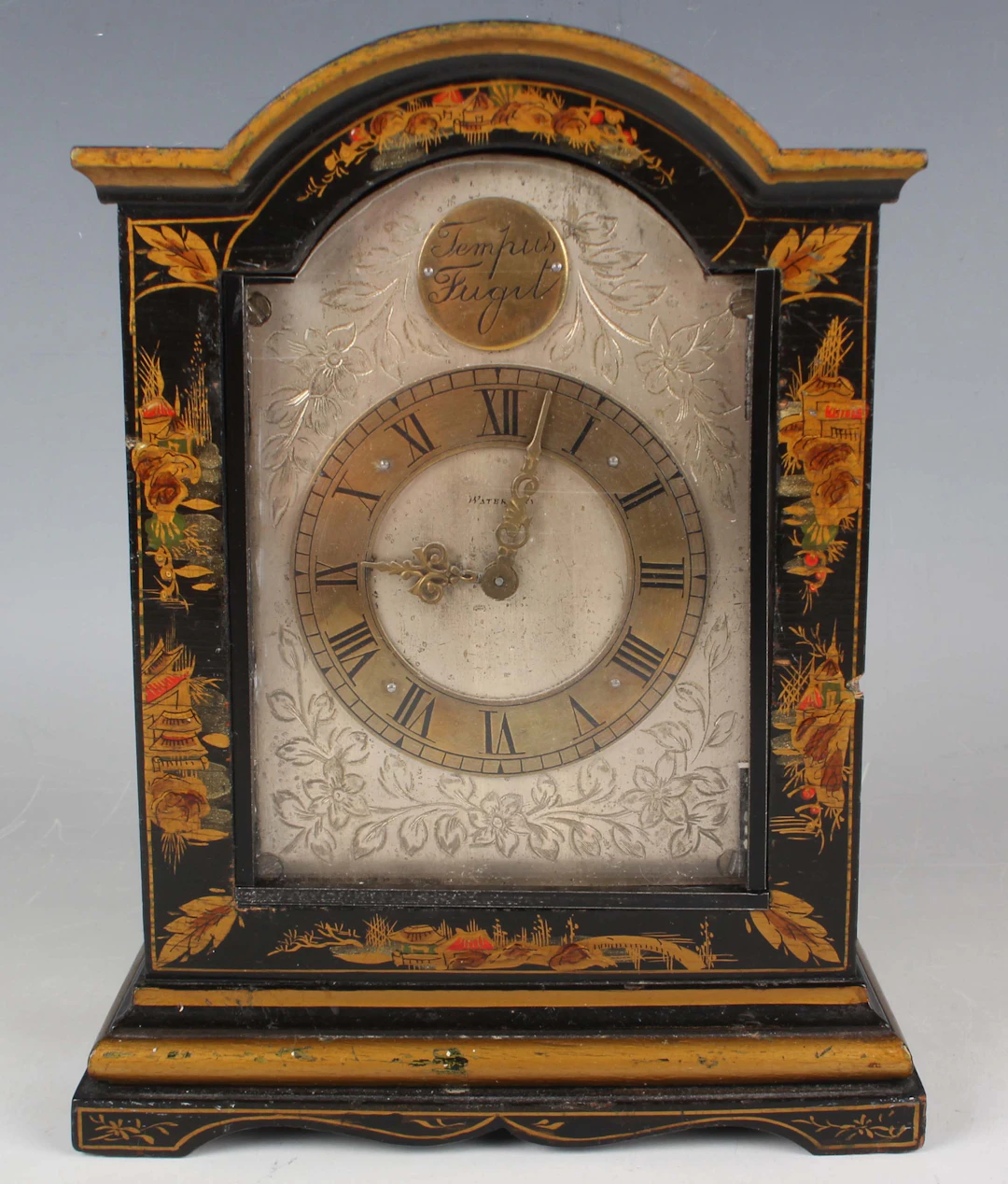 A George V chinoiserie cased mantel timepiece, the silvered dial with