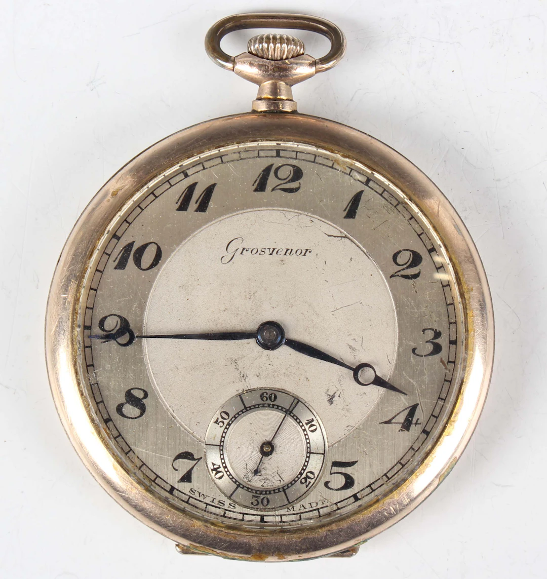 A Grosvenor gilt metal cased keyless wind open-faced gentleman's pocket