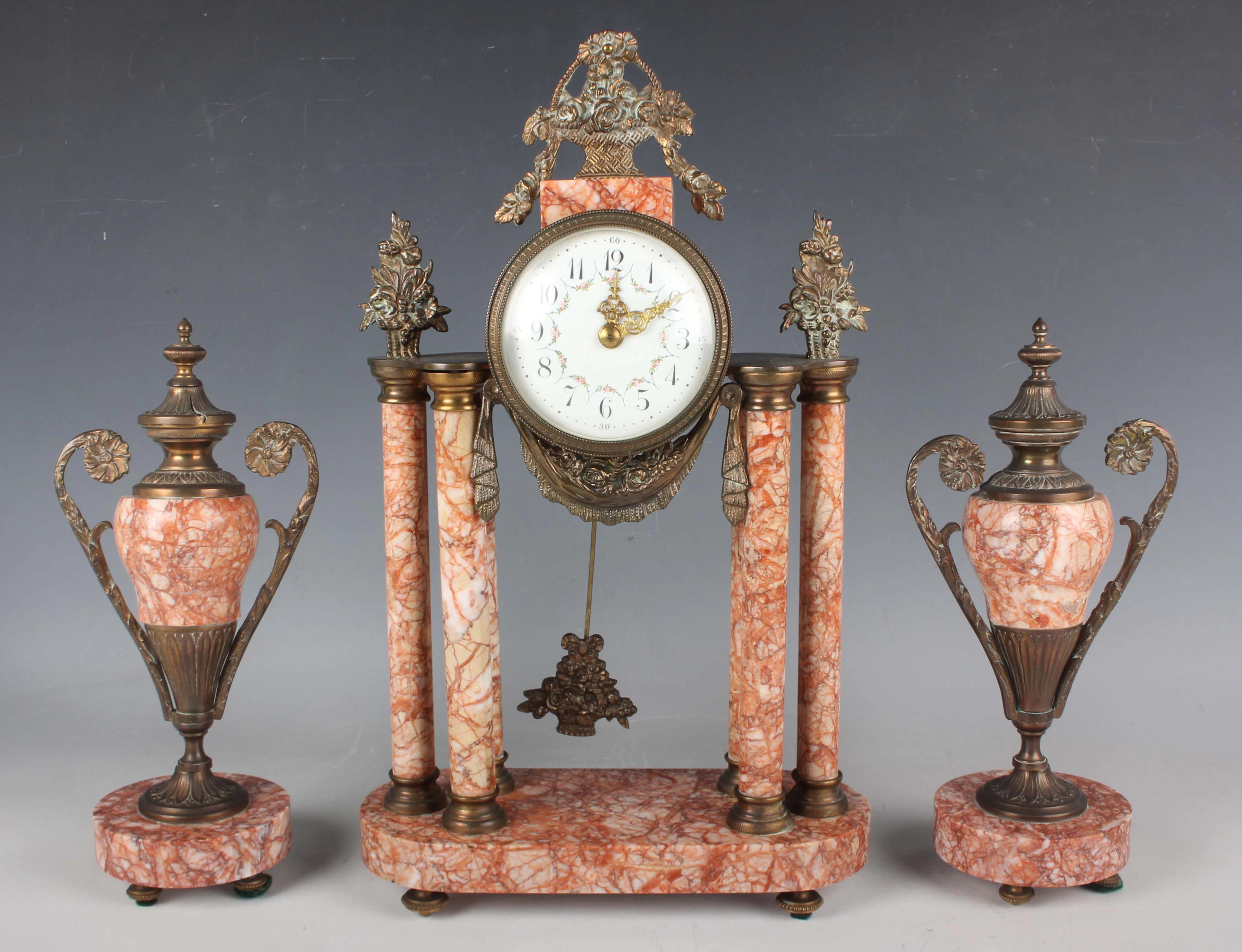 An early 20th century French rouge marble and gilt metal mounted clock