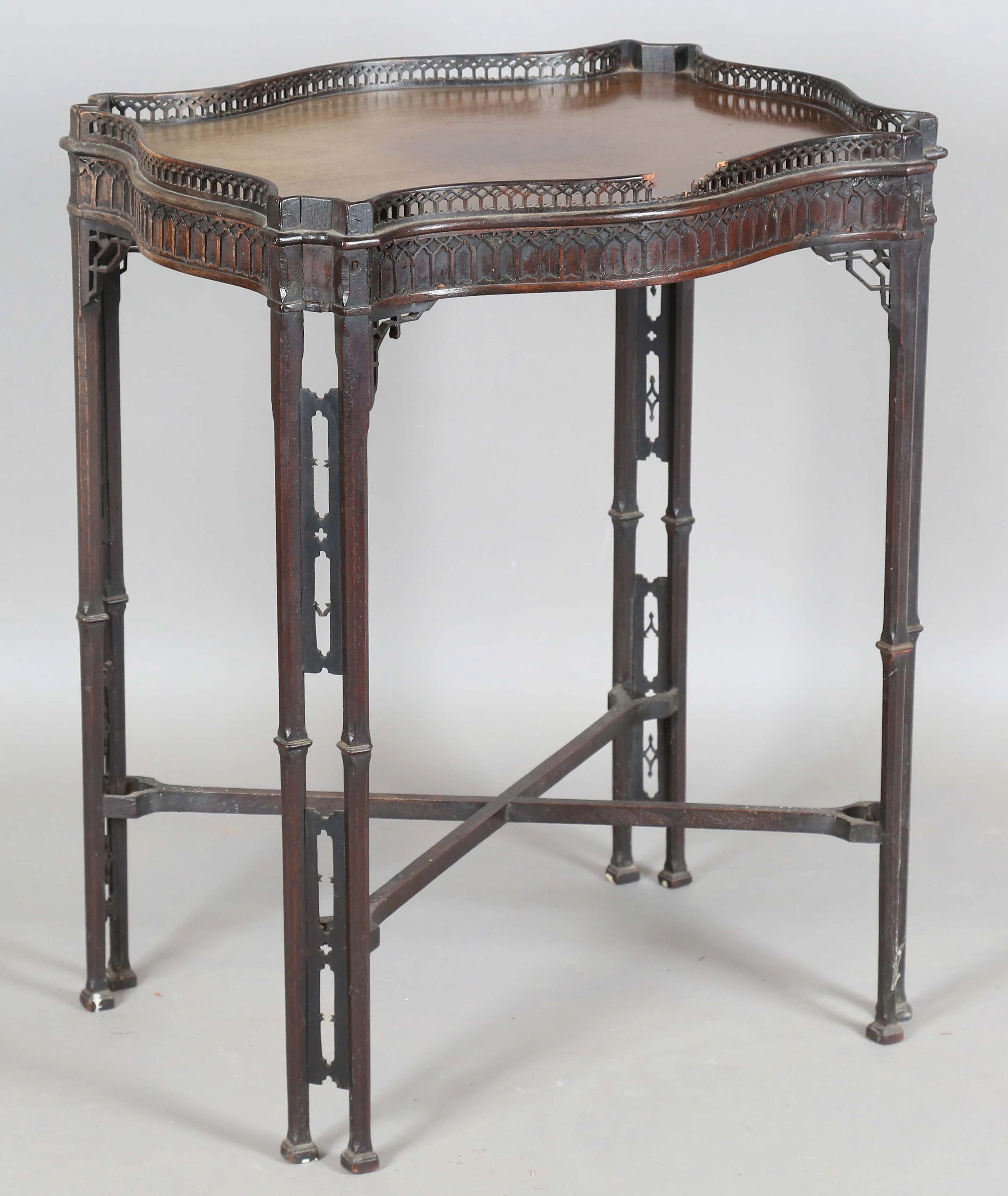 A George III Chippendale period mahogany silver table, the serpentine