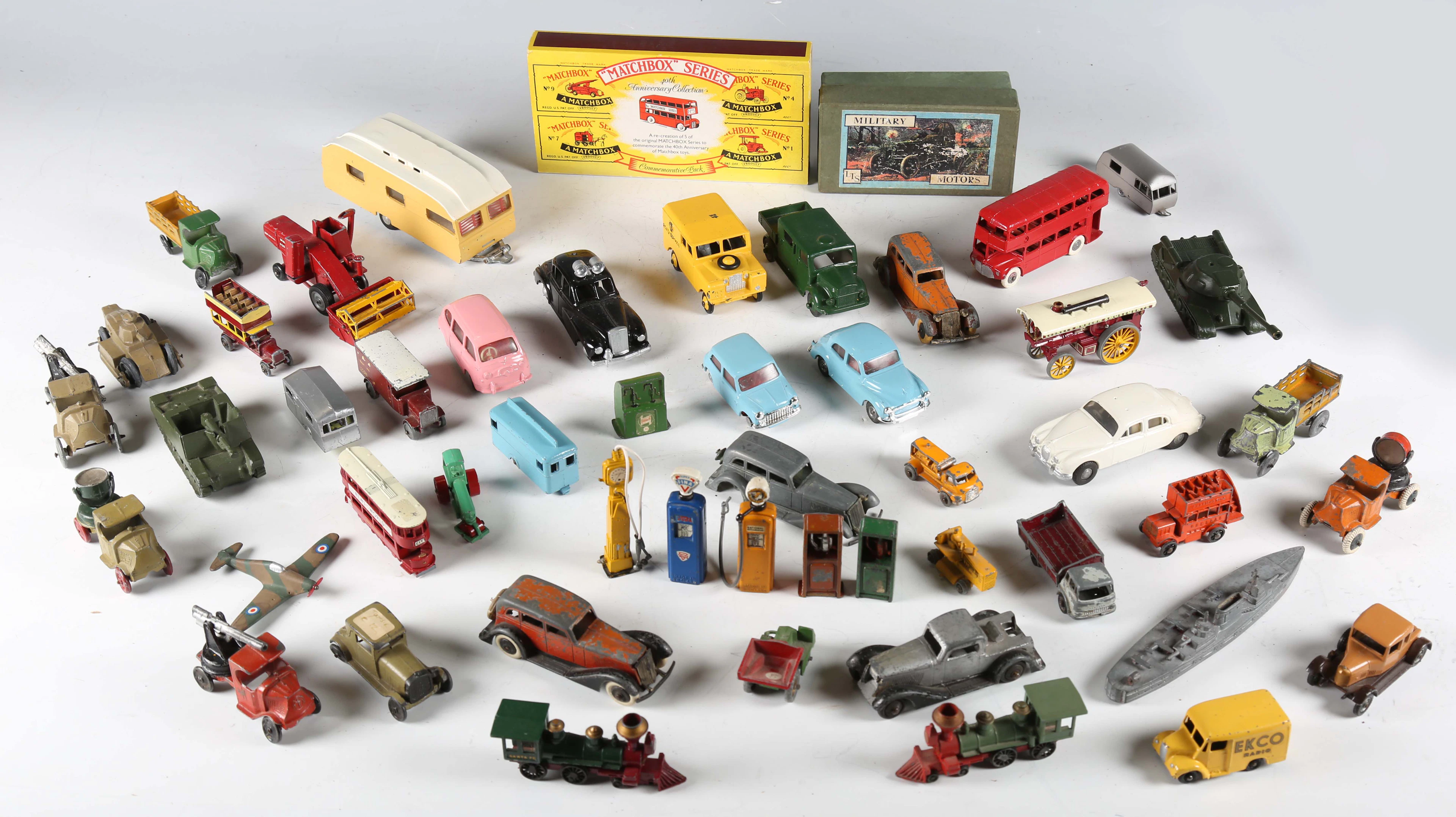 A group of diecast vehicles and accessories, including Tootsie Toys