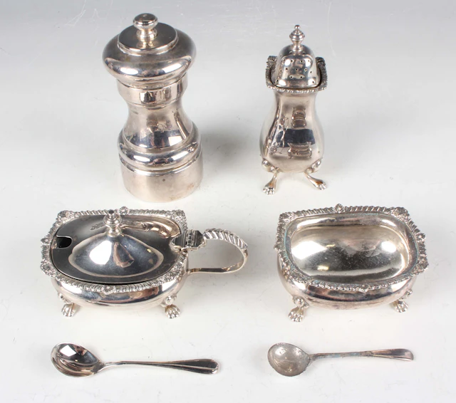 A George V silver three-piece condiment set, comprising salt, pepper