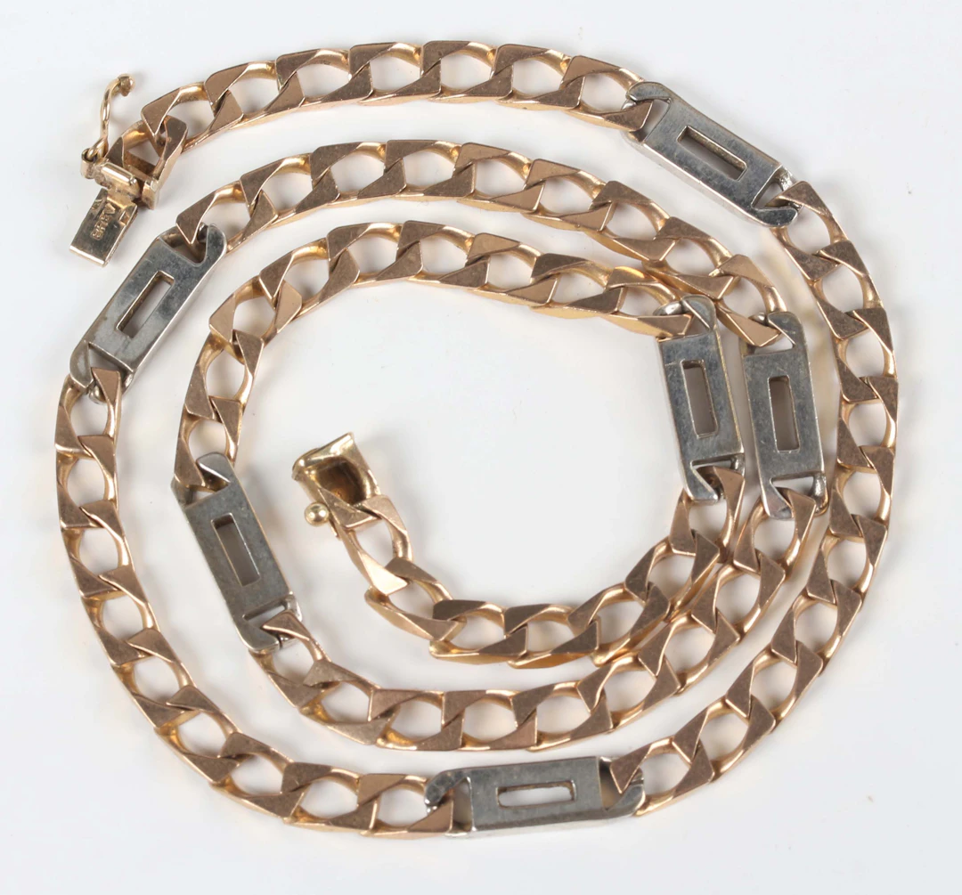An Italian Unoaerre 9ct gold and white metal faceted curblink and