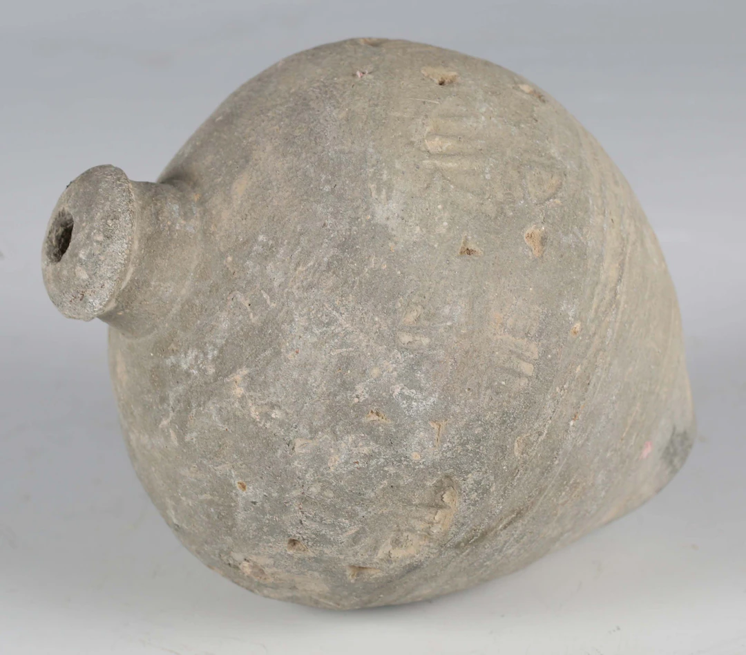 A Byzantine 'Greek Fire' hand grenade, 12th/14th century AD, the grey