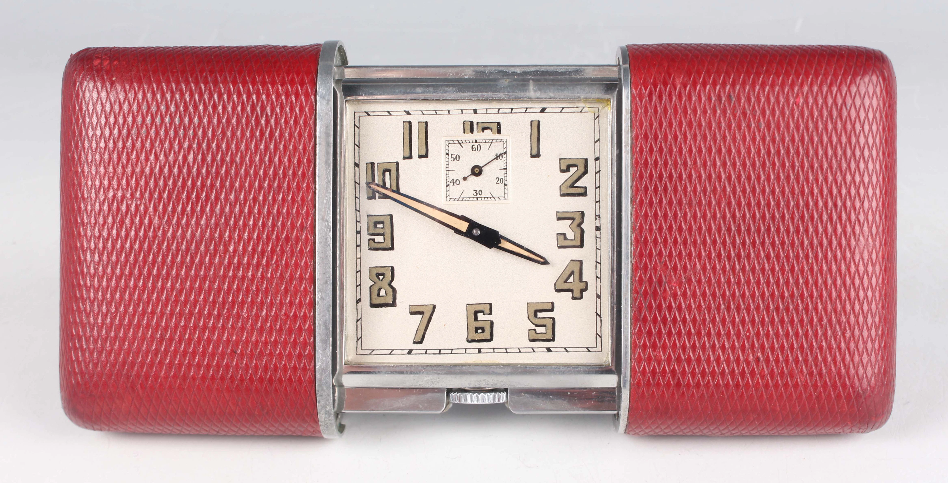 A Movado Pullman red leather and chrome cased travelling bedside timepiece