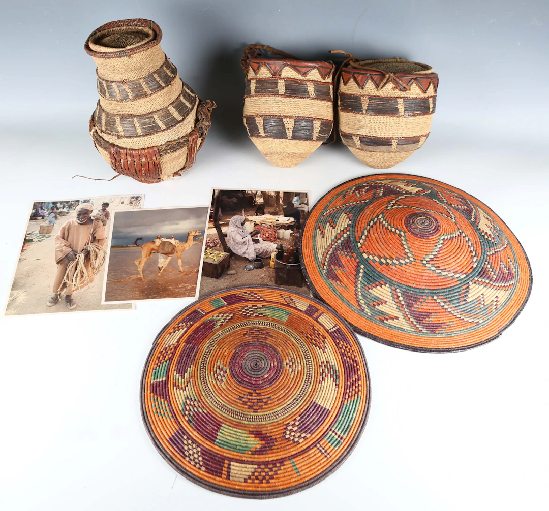 A group of Sudanese basketweave items, including two food covers and