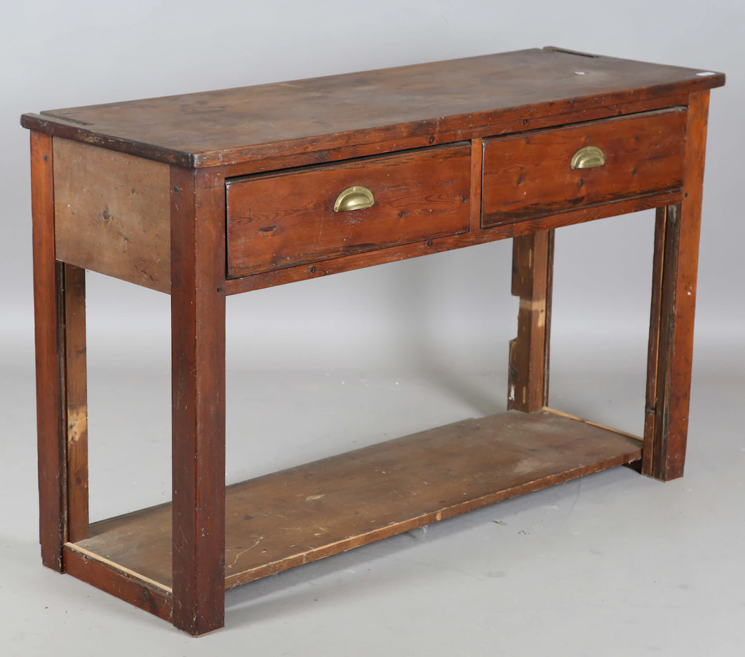 A 19th century pine two-drawer serving table, on block legs united
