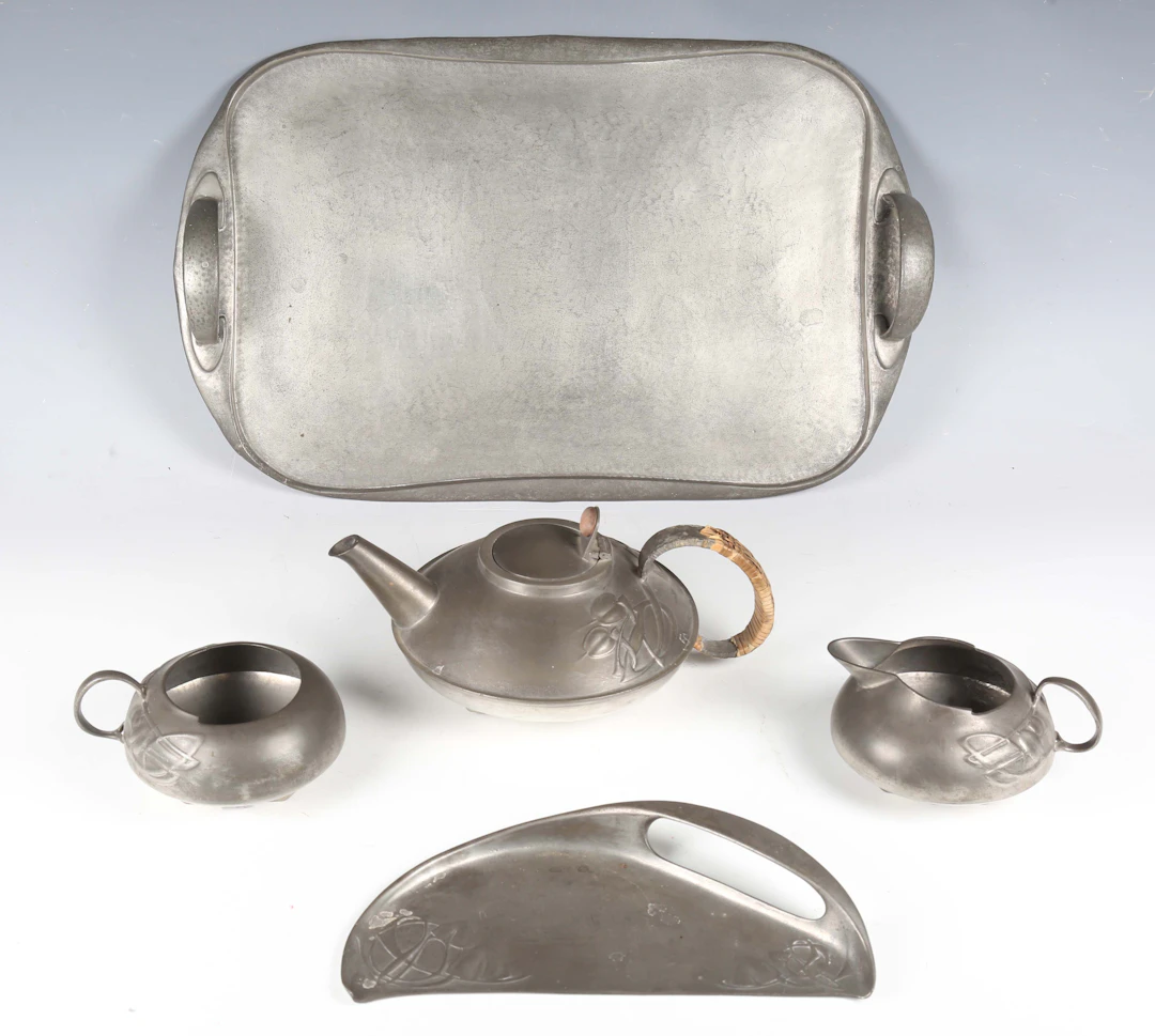 A Liberty & Co 'Tudric' pewter three-piece tea set, designed by Archibald